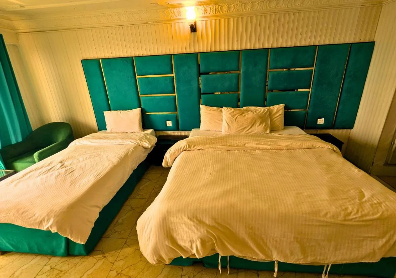 Bed in Grand Heights Hotel