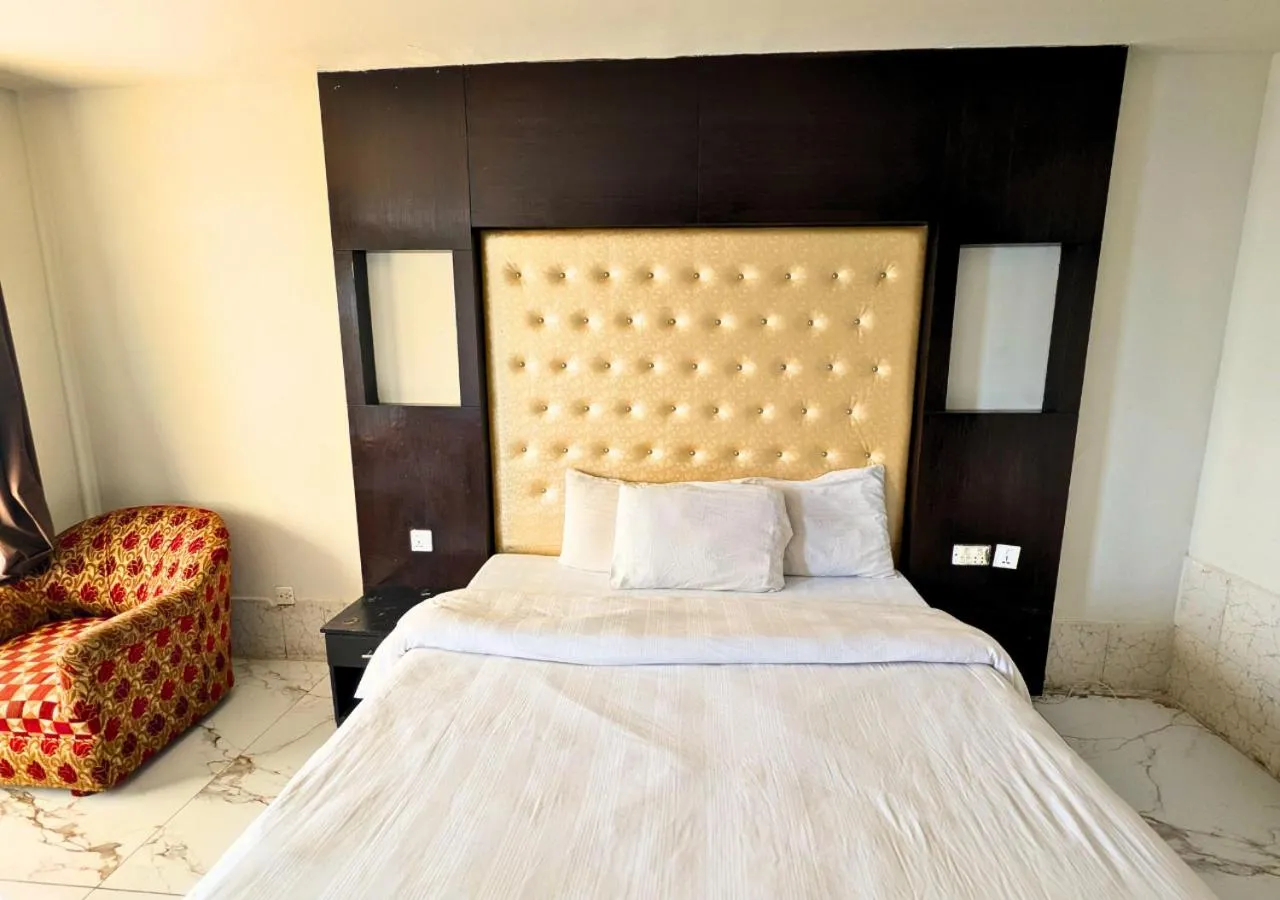 Bed in Grand Heights Hotel