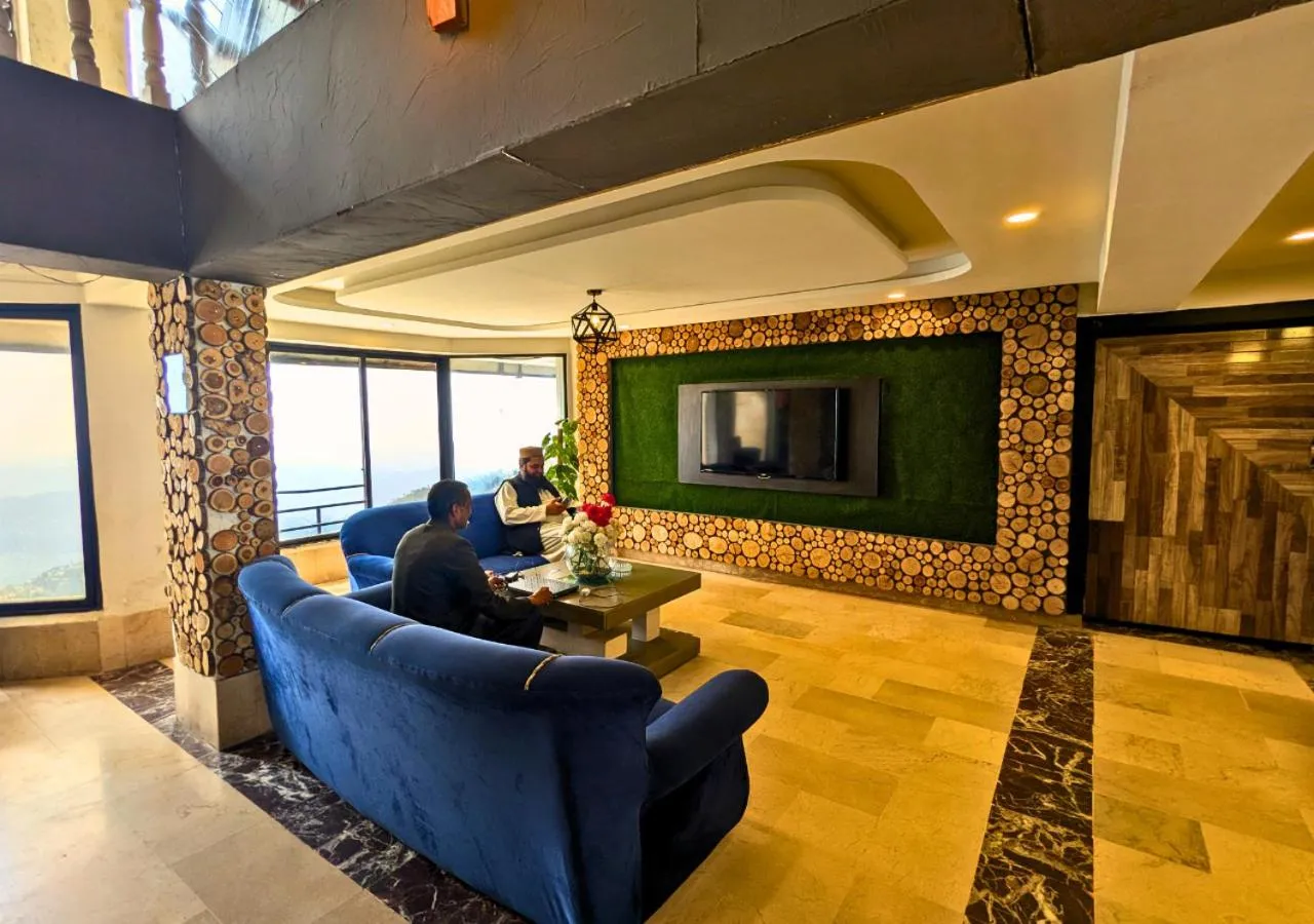 Communal lounge/ TV room in Grand Heights Hotel