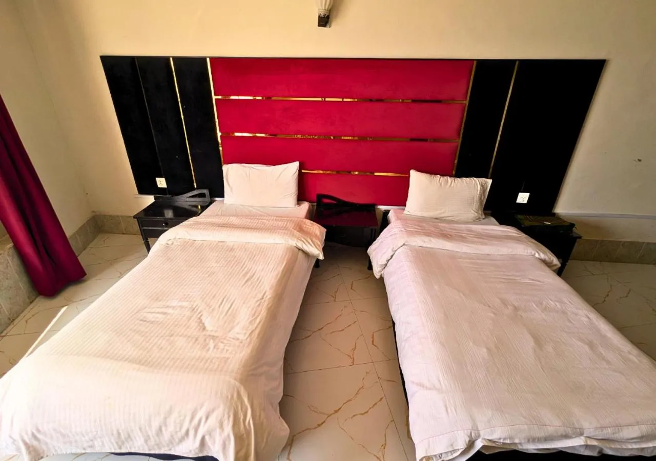 Bed in Grand Heights Hotel
