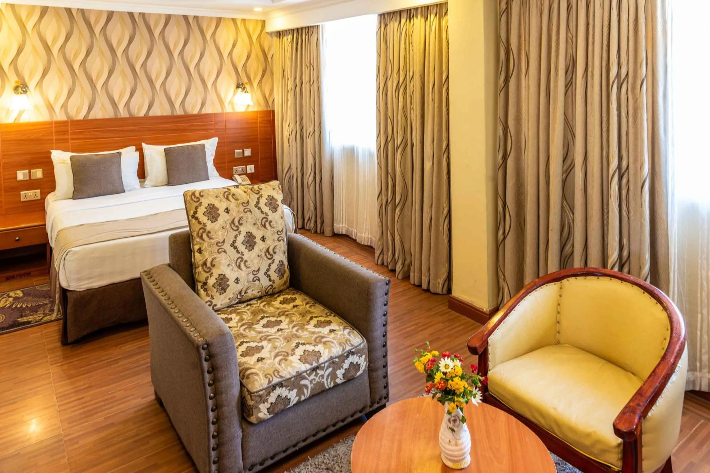 Seating area, Bed in Hillcourt Resort and Spa