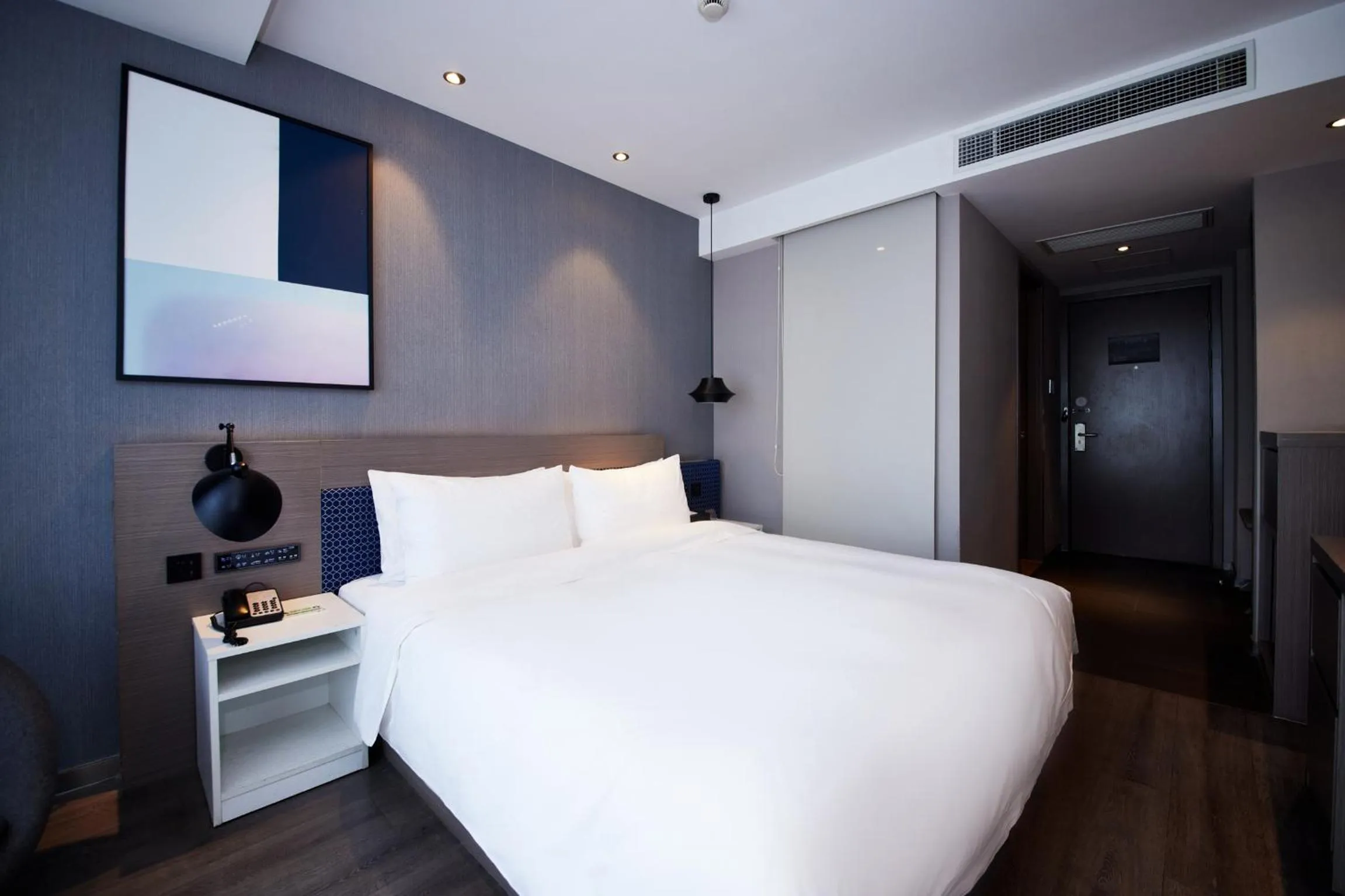 Bed in Orange Hotel Shanghai Hongkou Football Stadium Branch