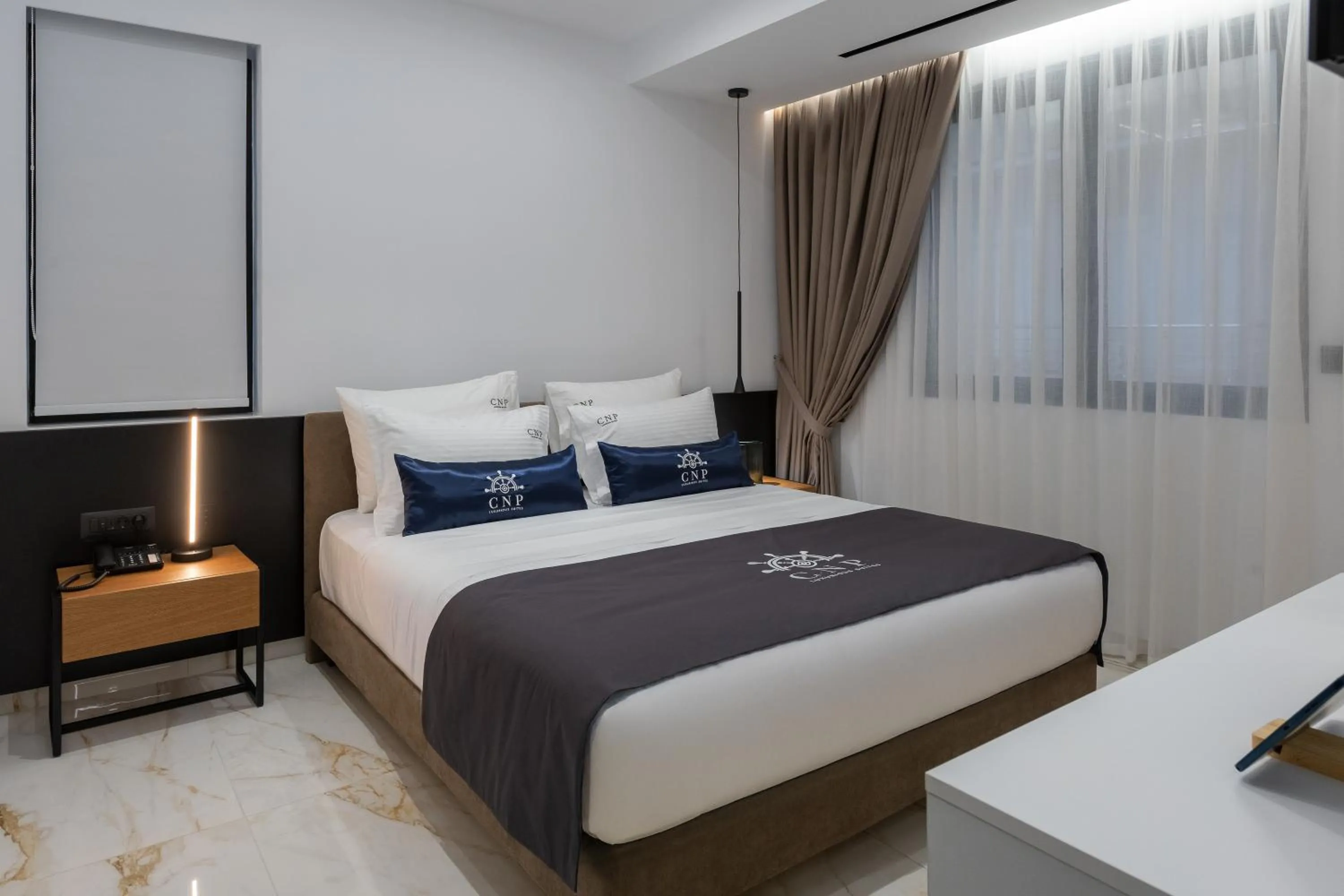 Bed in Captain Napoleon Paterakis CNP Luxurious Suites