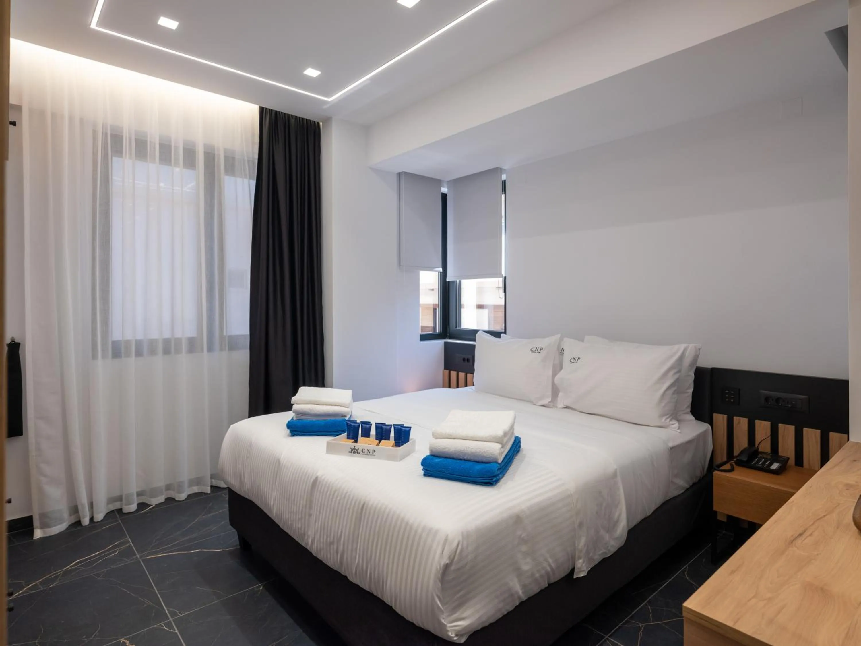 Bed in Captain Napoleon Paterakis CNP Luxurious Suites