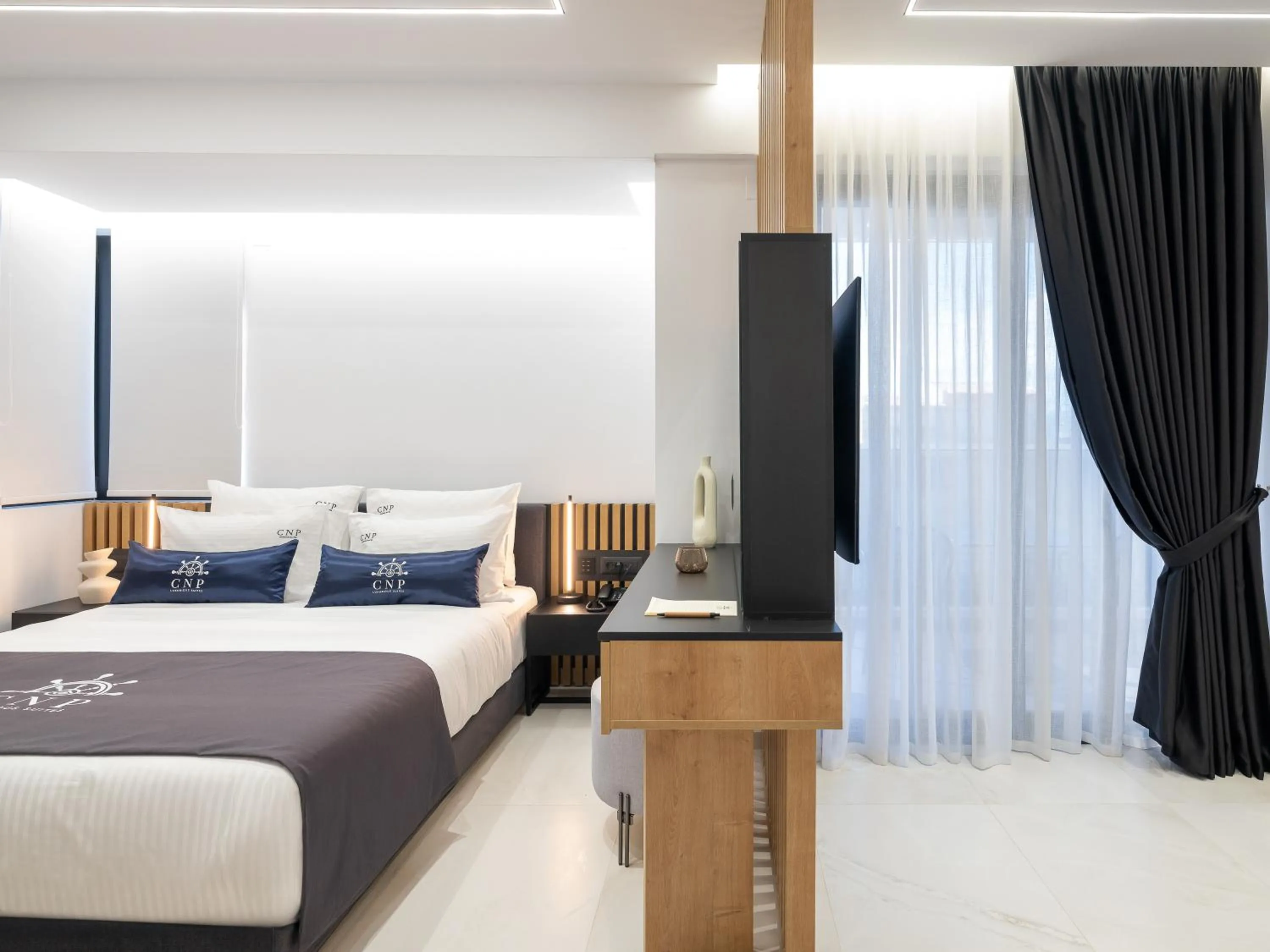 Bed in Captain Napoleon Paterakis CNP Luxurious Suites