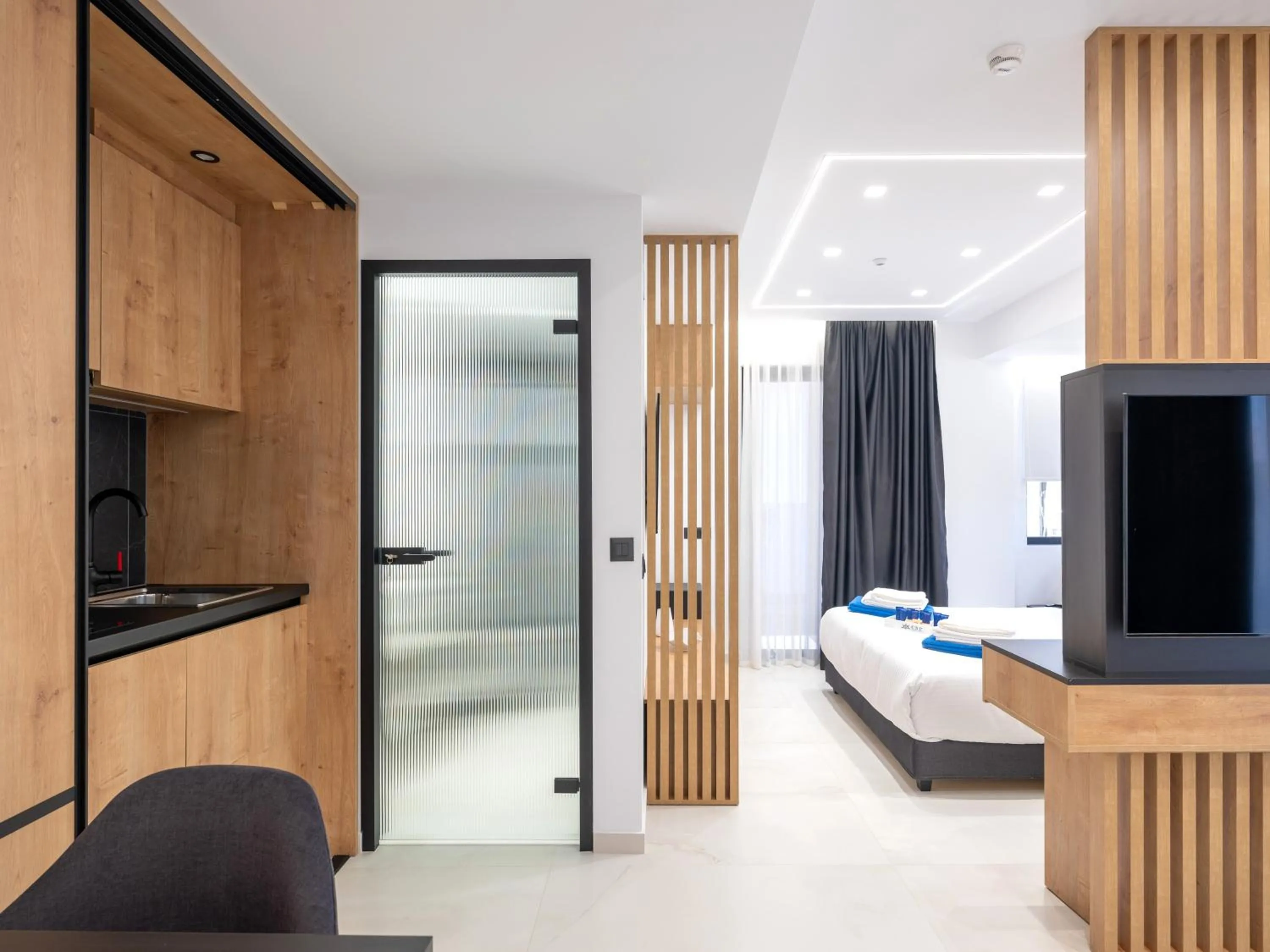 Bed in Captain Napoleon Paterakis CNP Luxurious Suites