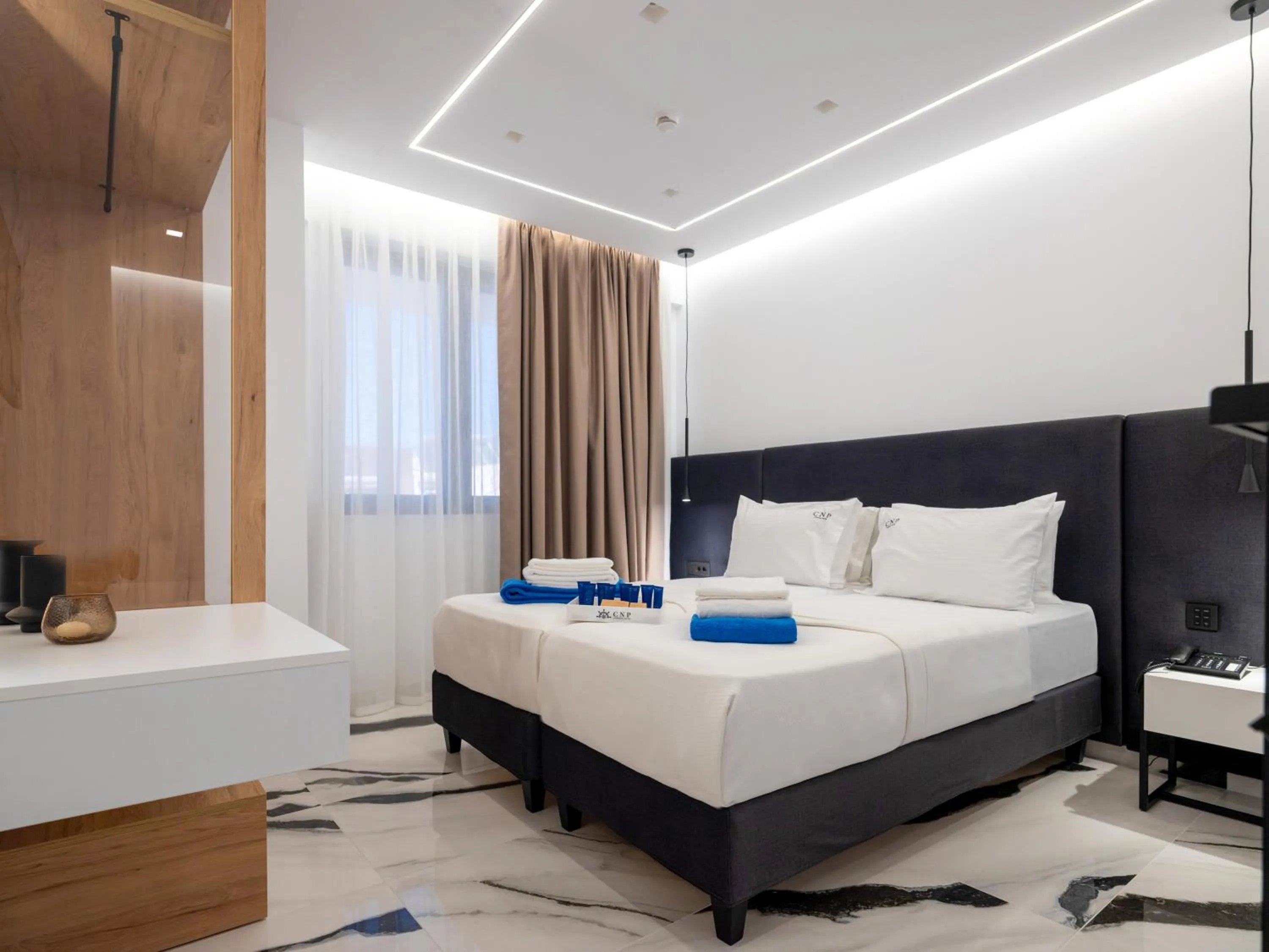 Bed in Captain Napoleon Paterakis CNP Luxurious Suites