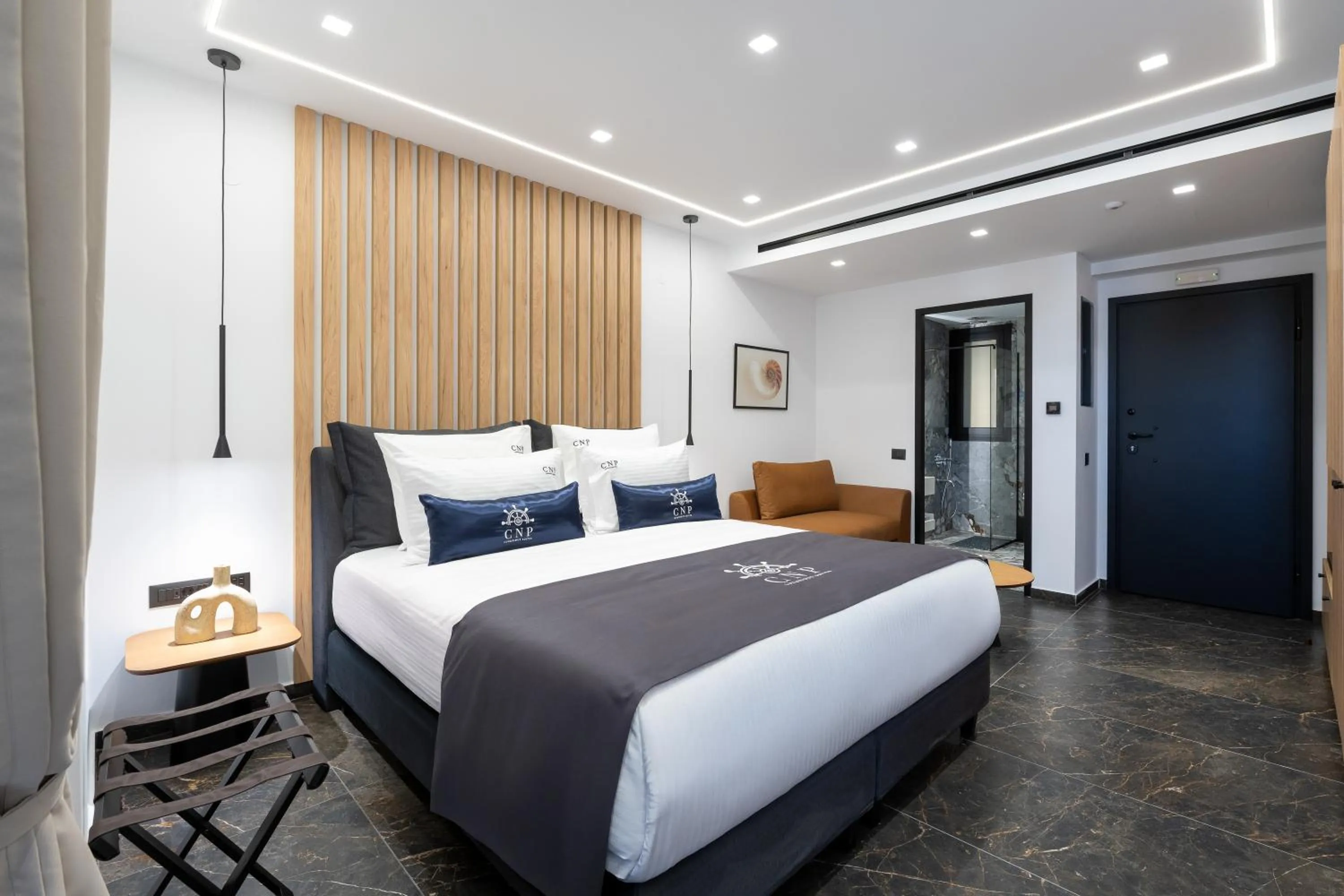 Bed in Captain Napoleon Paterakis CNP Luxurious Suites