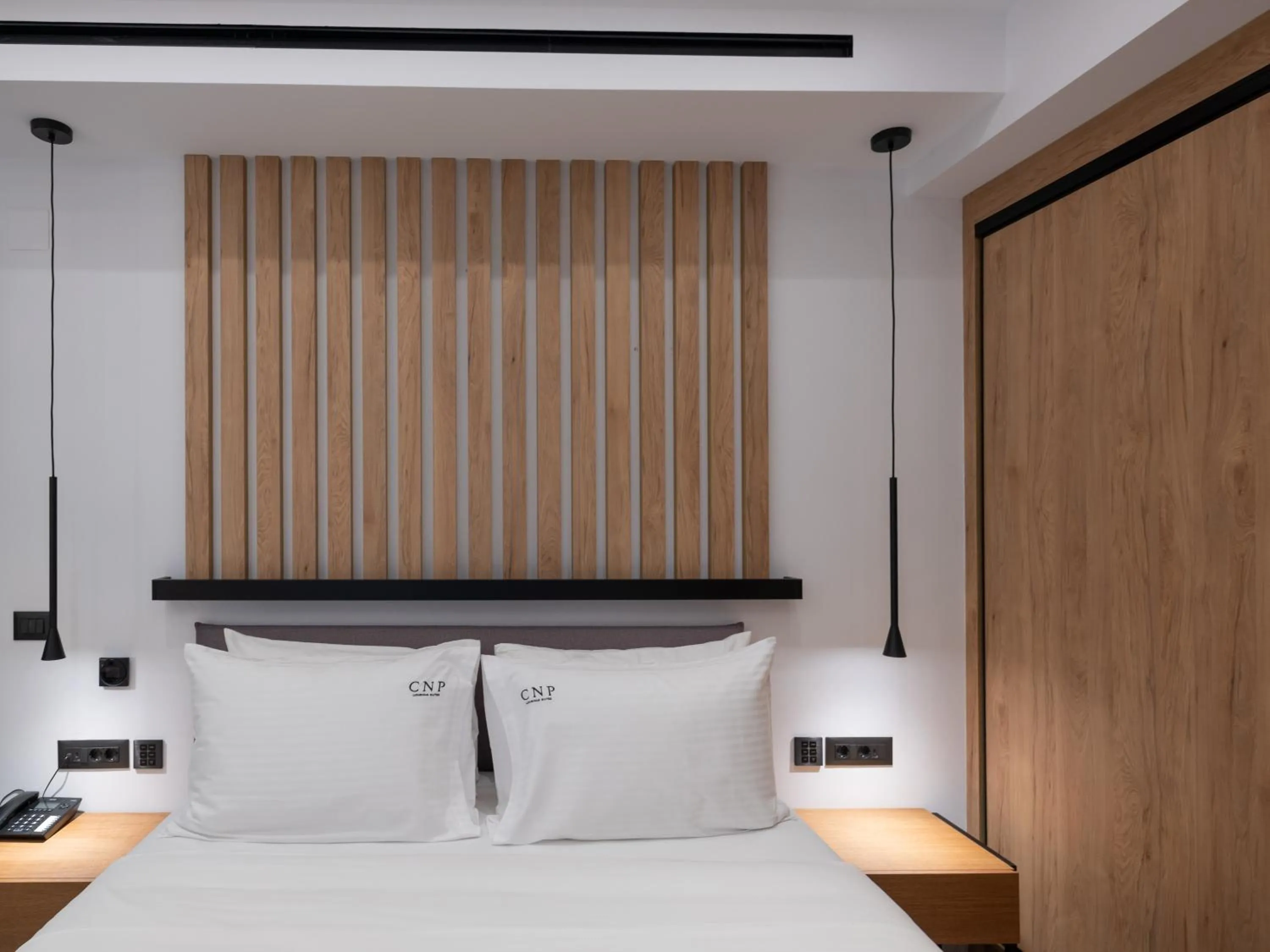 Bed in Captain Napoleon Paterakis CNP Luxurious Suites