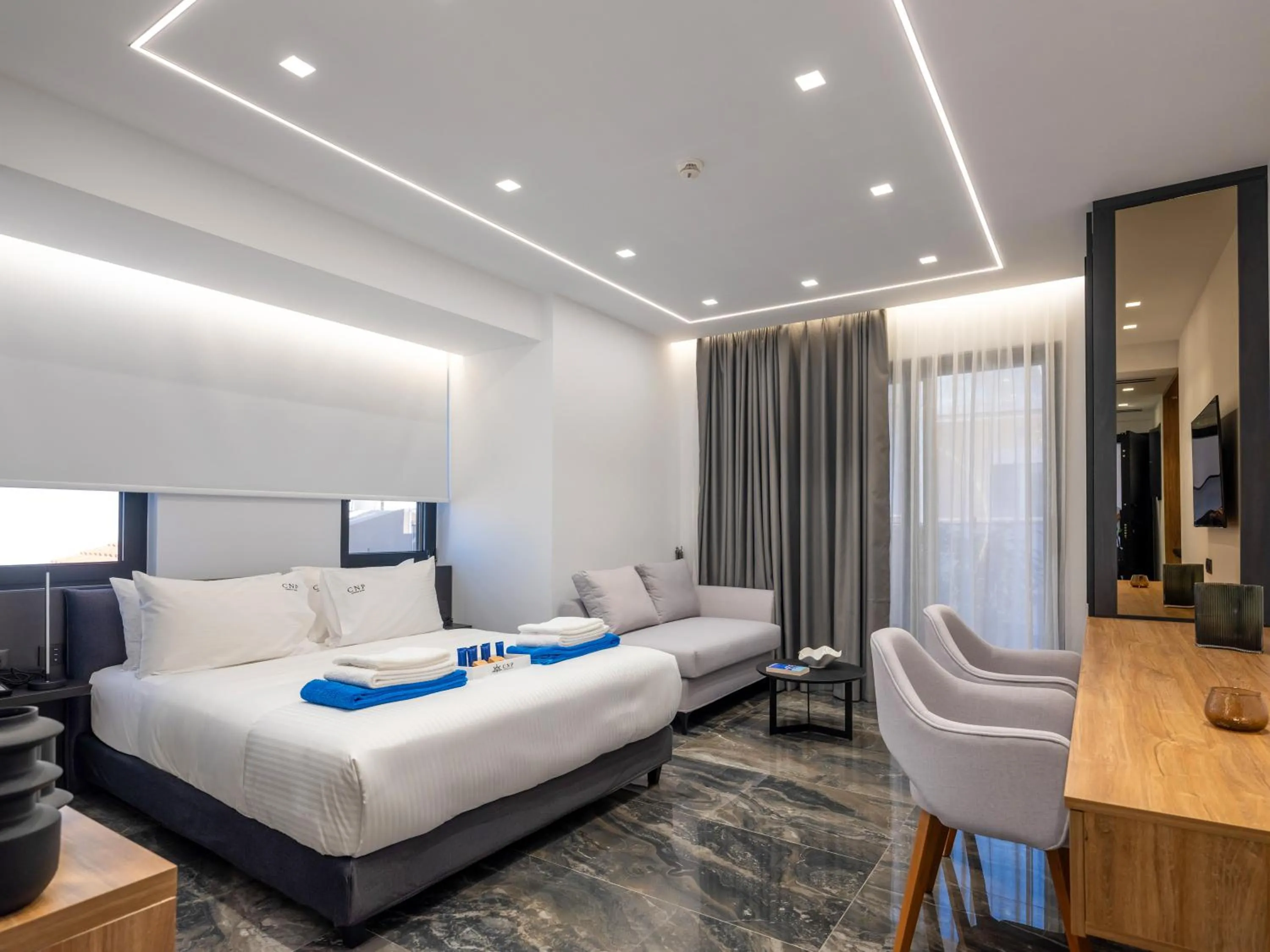 Bed in Captain Napoleon Paterakis CNP Luxurious Suites