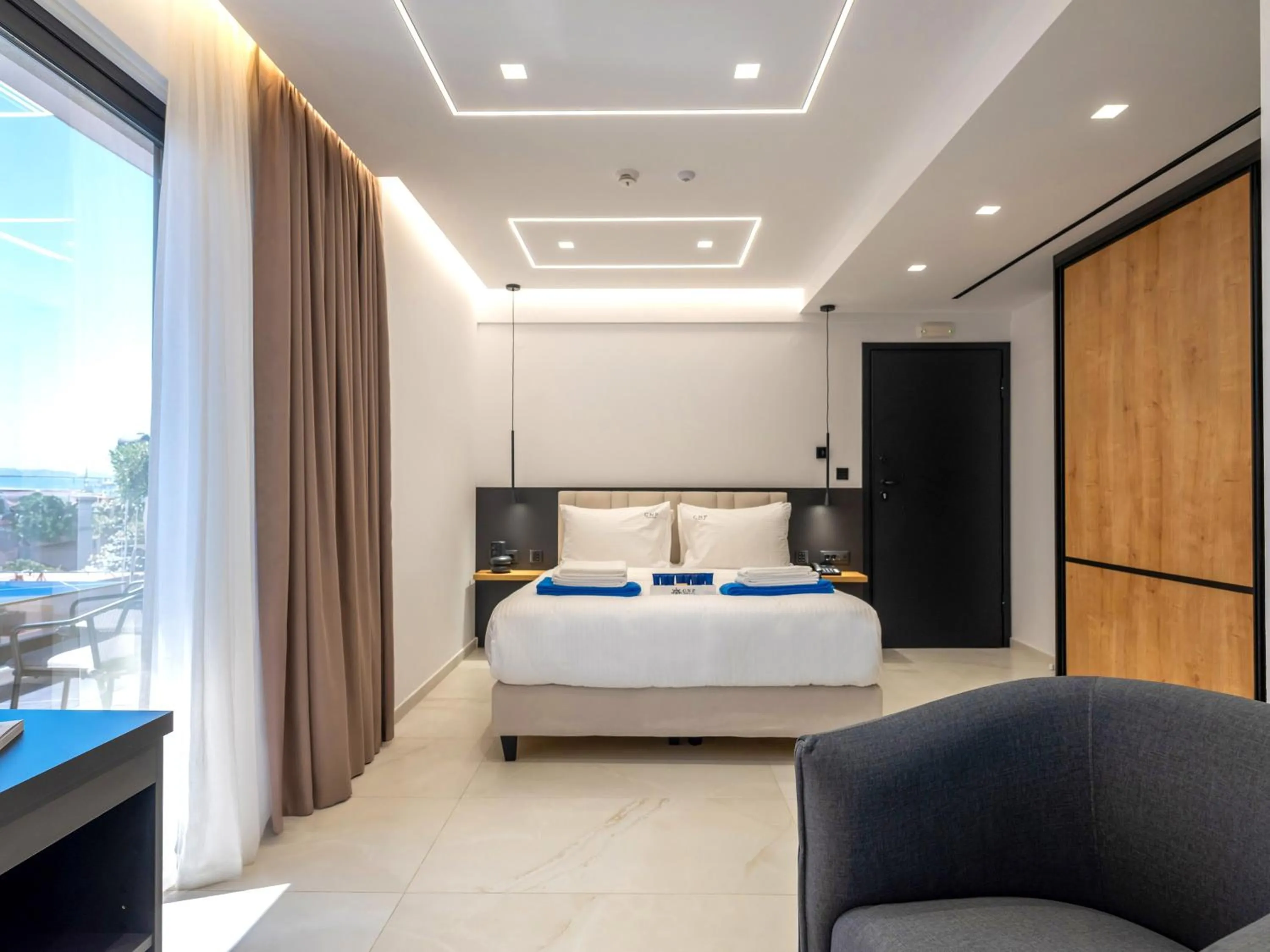 Bed in Captain Napoleon Paterakis CNP Luxurious Suites