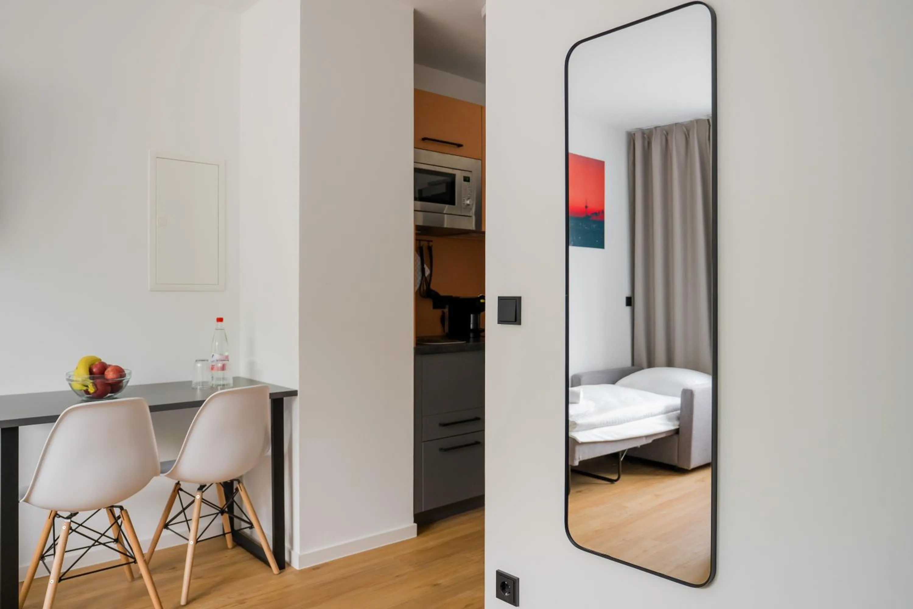 Kitchen or kitchenette, Bed in Homaris Apartments Nibelungen