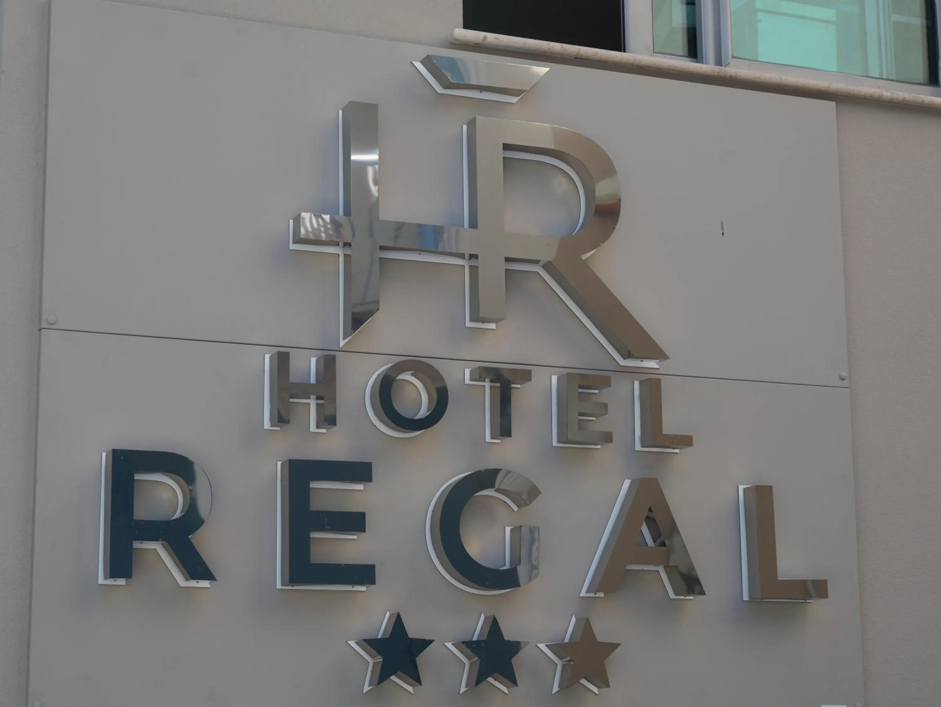 Property logo or sign in Hotel Regal