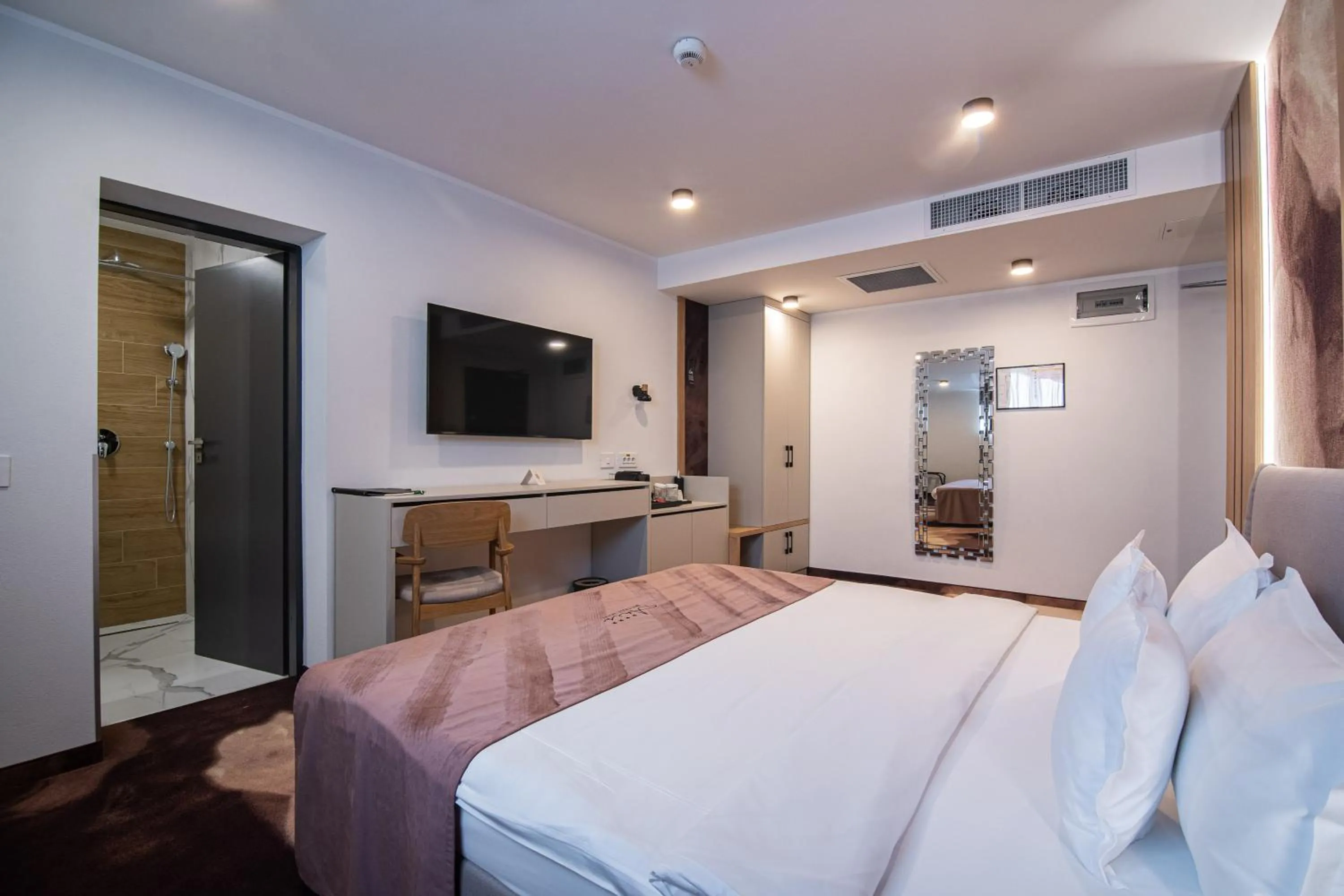 Bed in ARIS Boutique Hotel & SPA