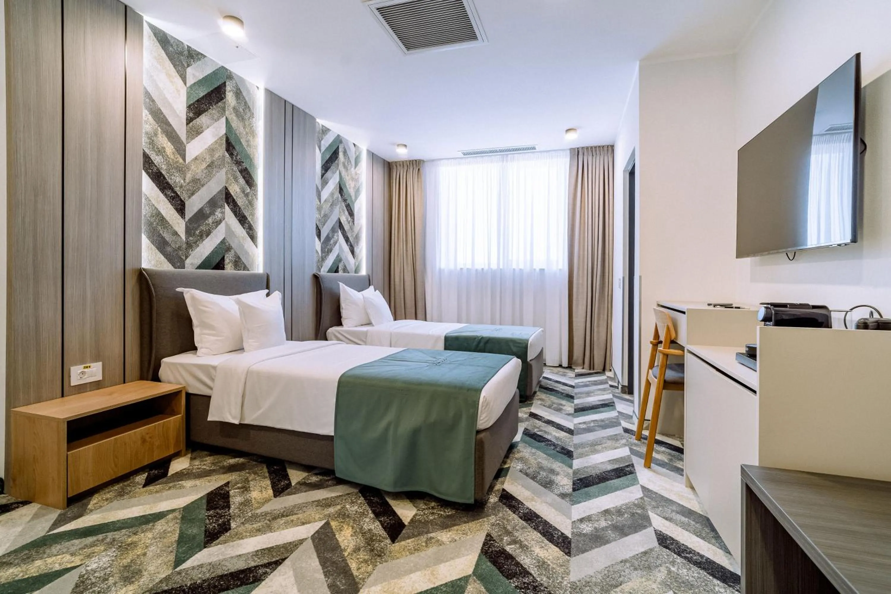 Bed in ARIS Boutique Hotel & SPA