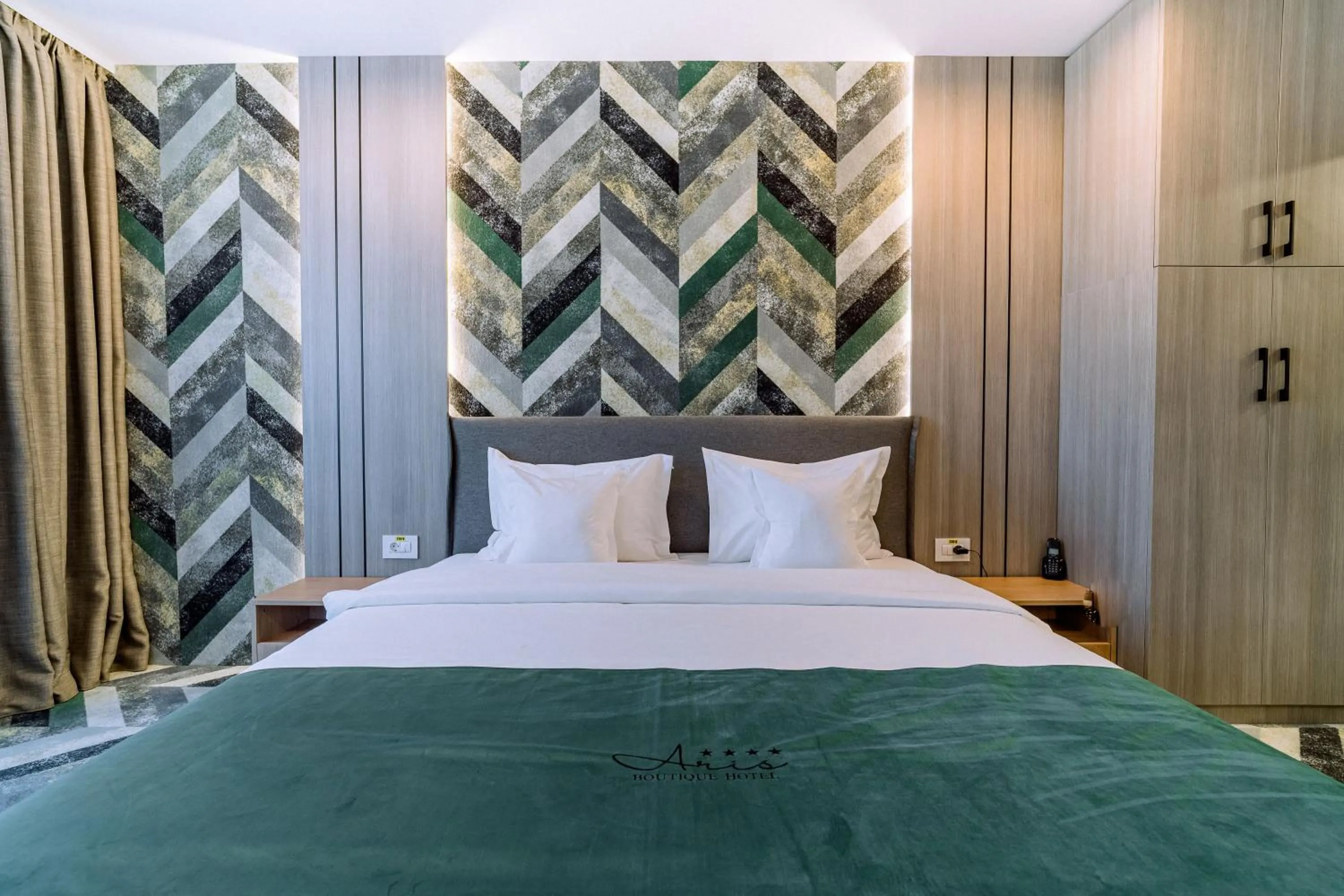 Bed in ARIS Boutique Hotel & SPA