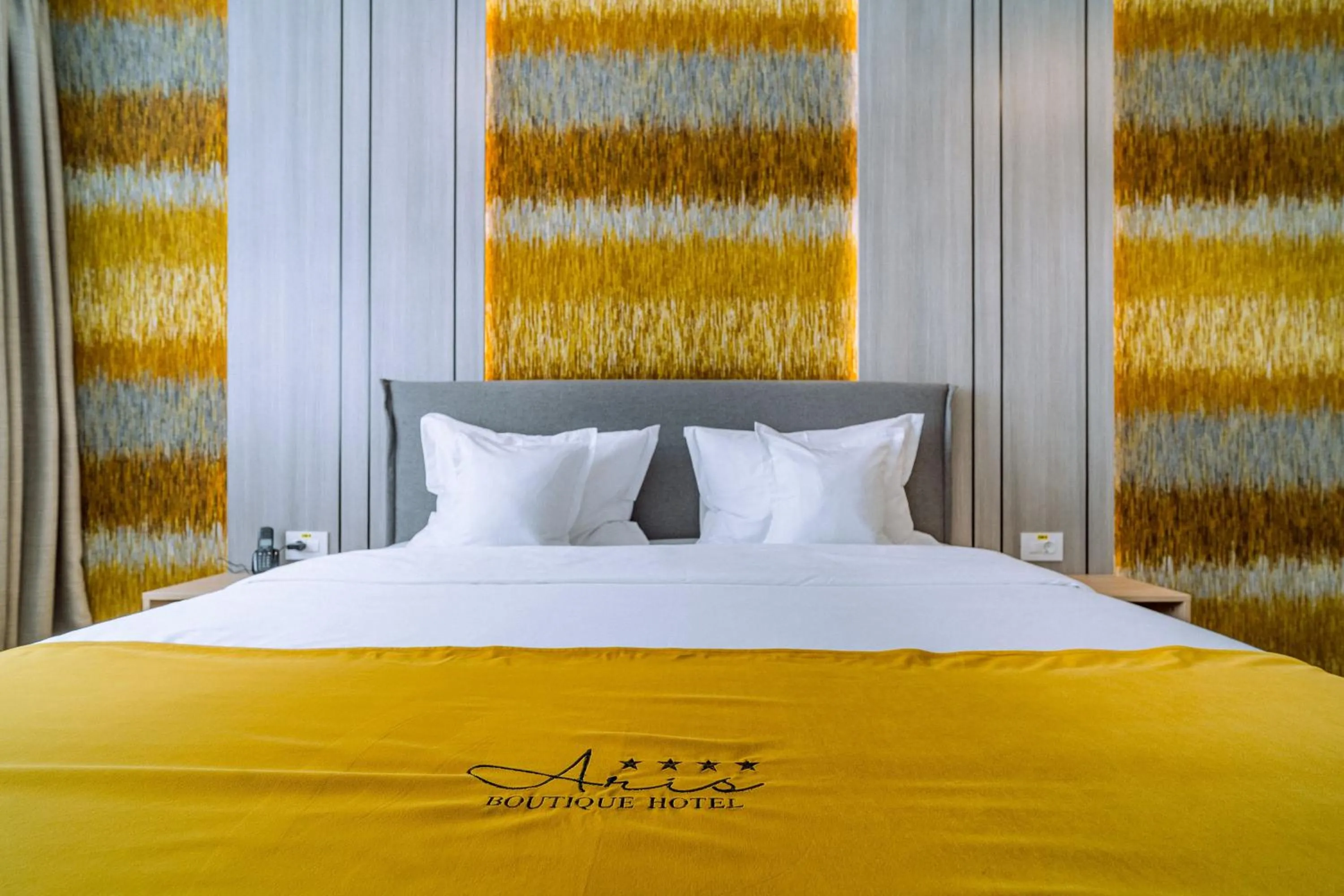 Bed in ARIS Boutique Hotel & SPA