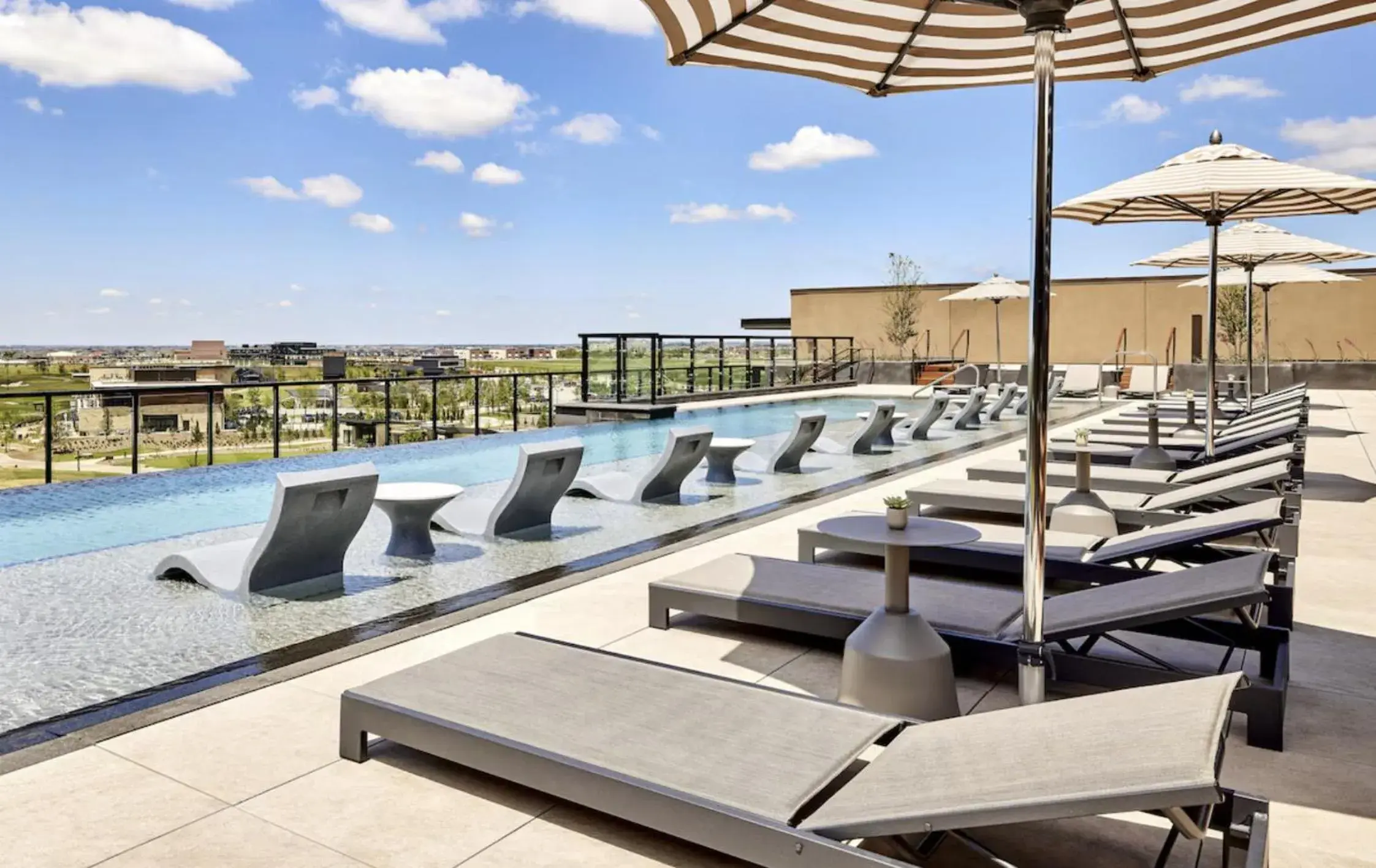 Swimming pool in Omni PGA Frisco Resort by Suiteness Swimming pool in Omni PGA Frisco Resort by Suiteness