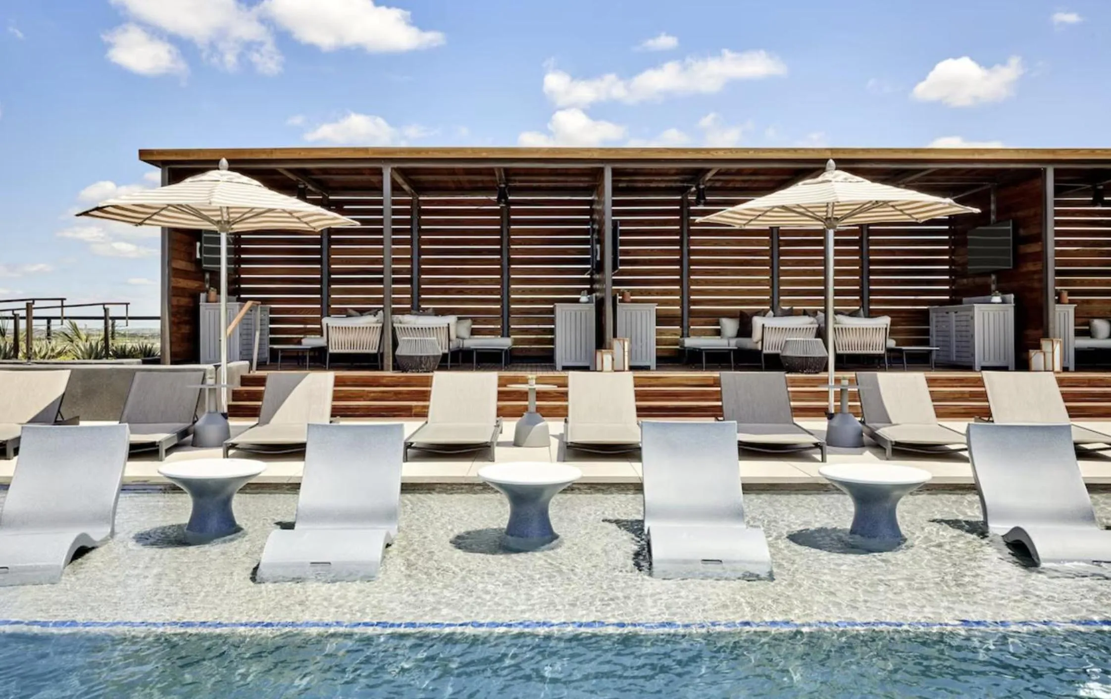 Swimming pool in Omni PGA Frisco Resort by Suiteness