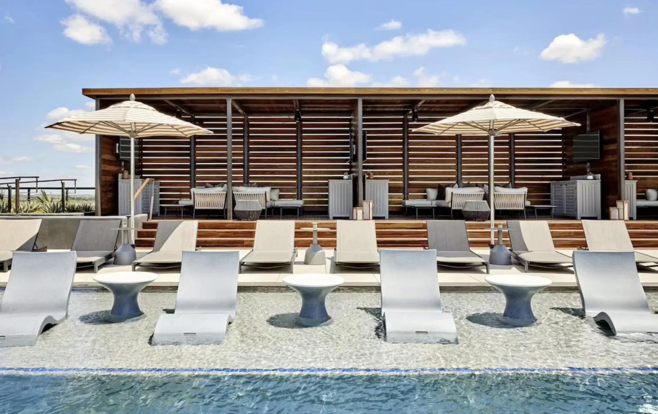 Swimming pool in Omni PGA Frisco Resort by Suiteness Swimming pool in Omni PGA Frisco Resort by Suiteness