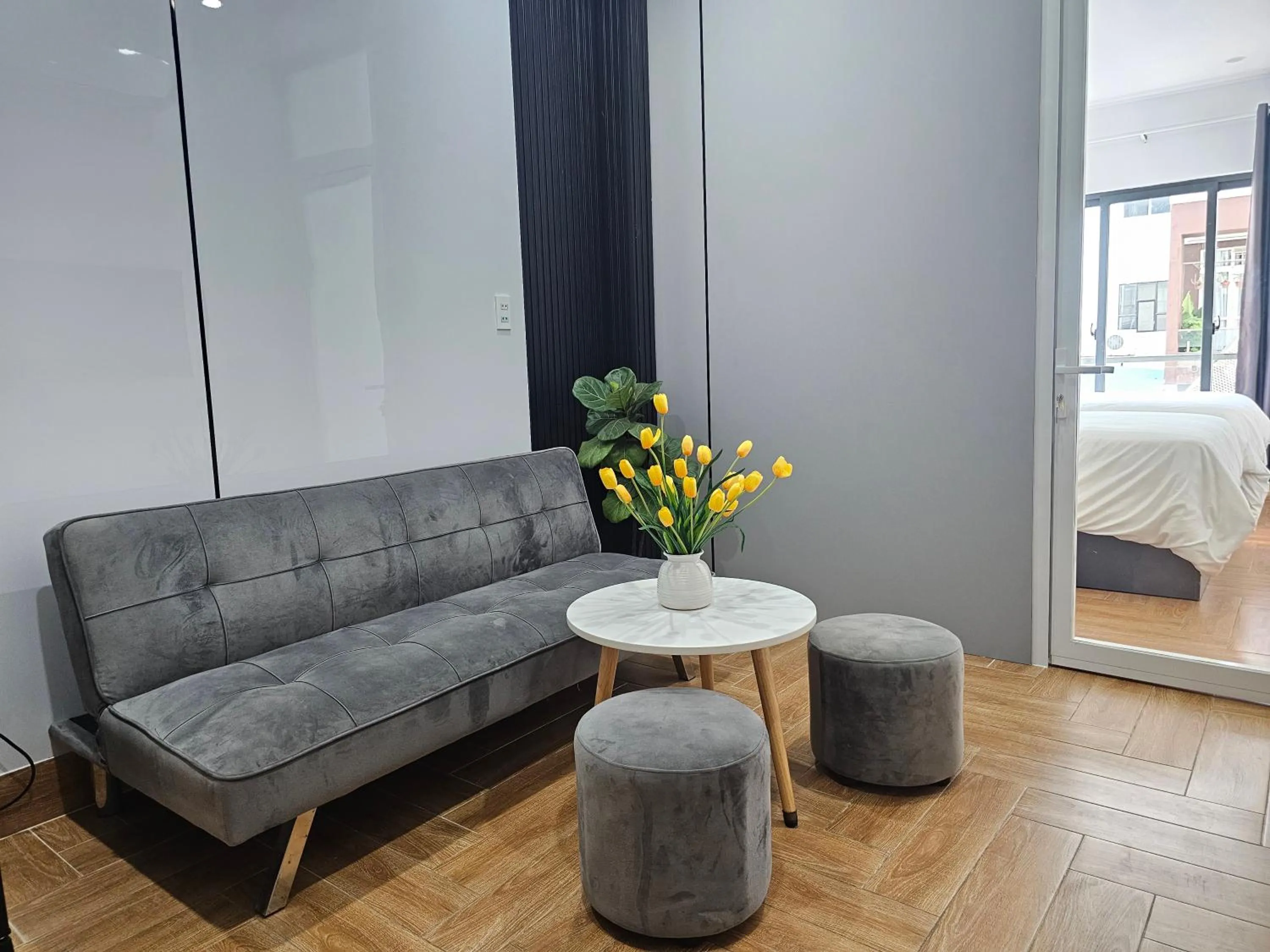 Living room, Bed in APEC Hotel