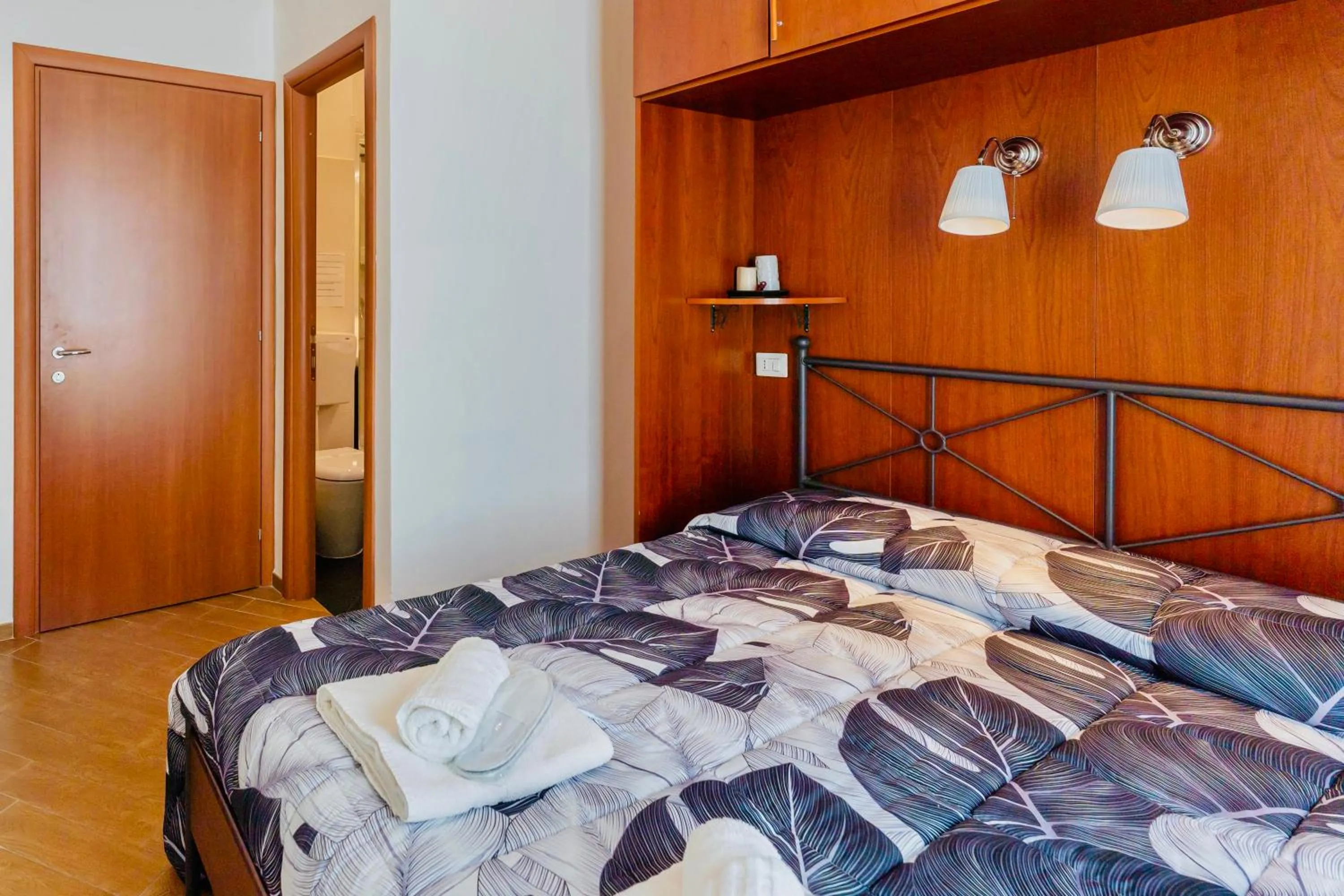 Bed in MICLAD Colosseum Guest House