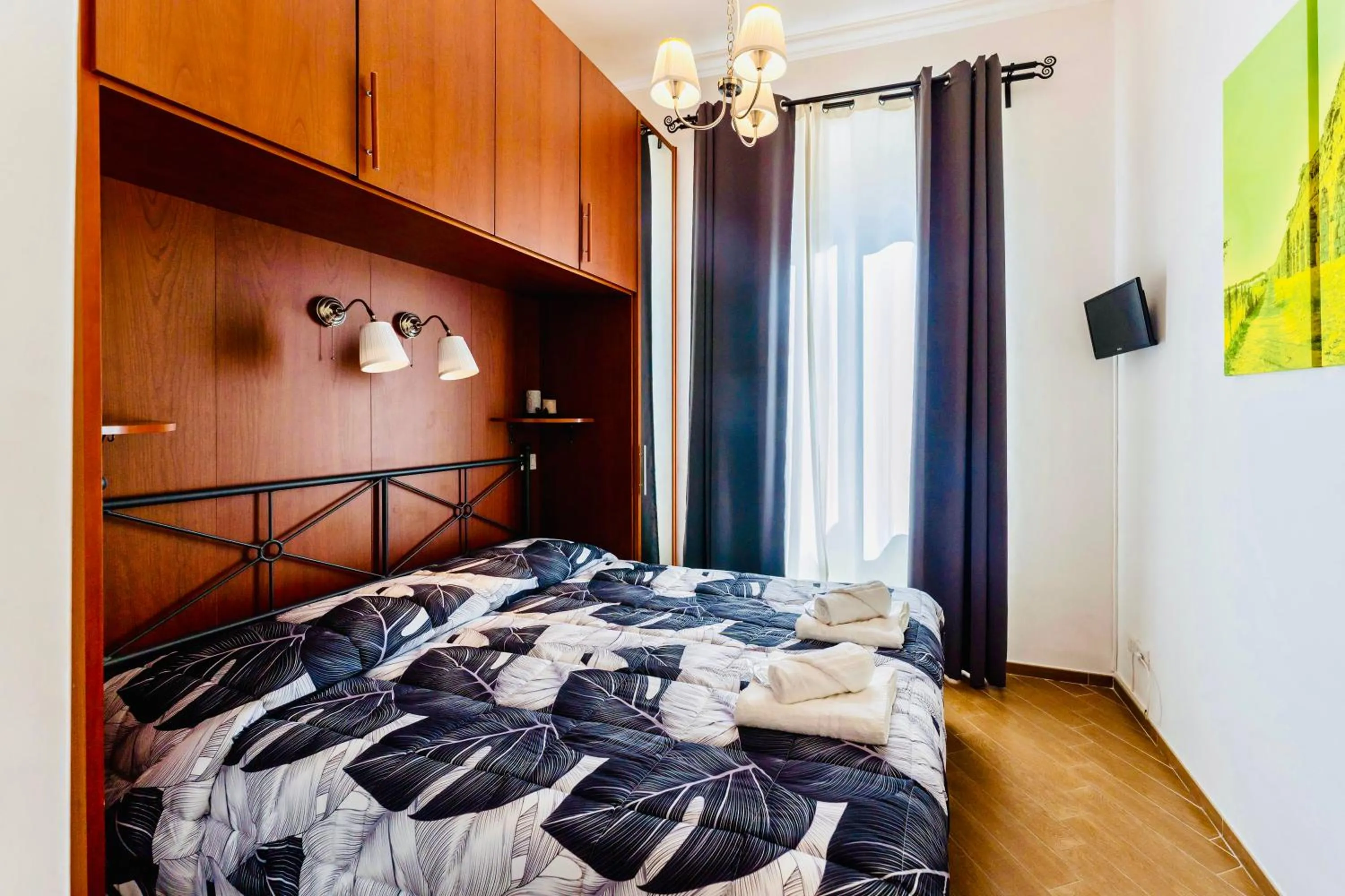 Bed in MICLAD Colosseum Guest House