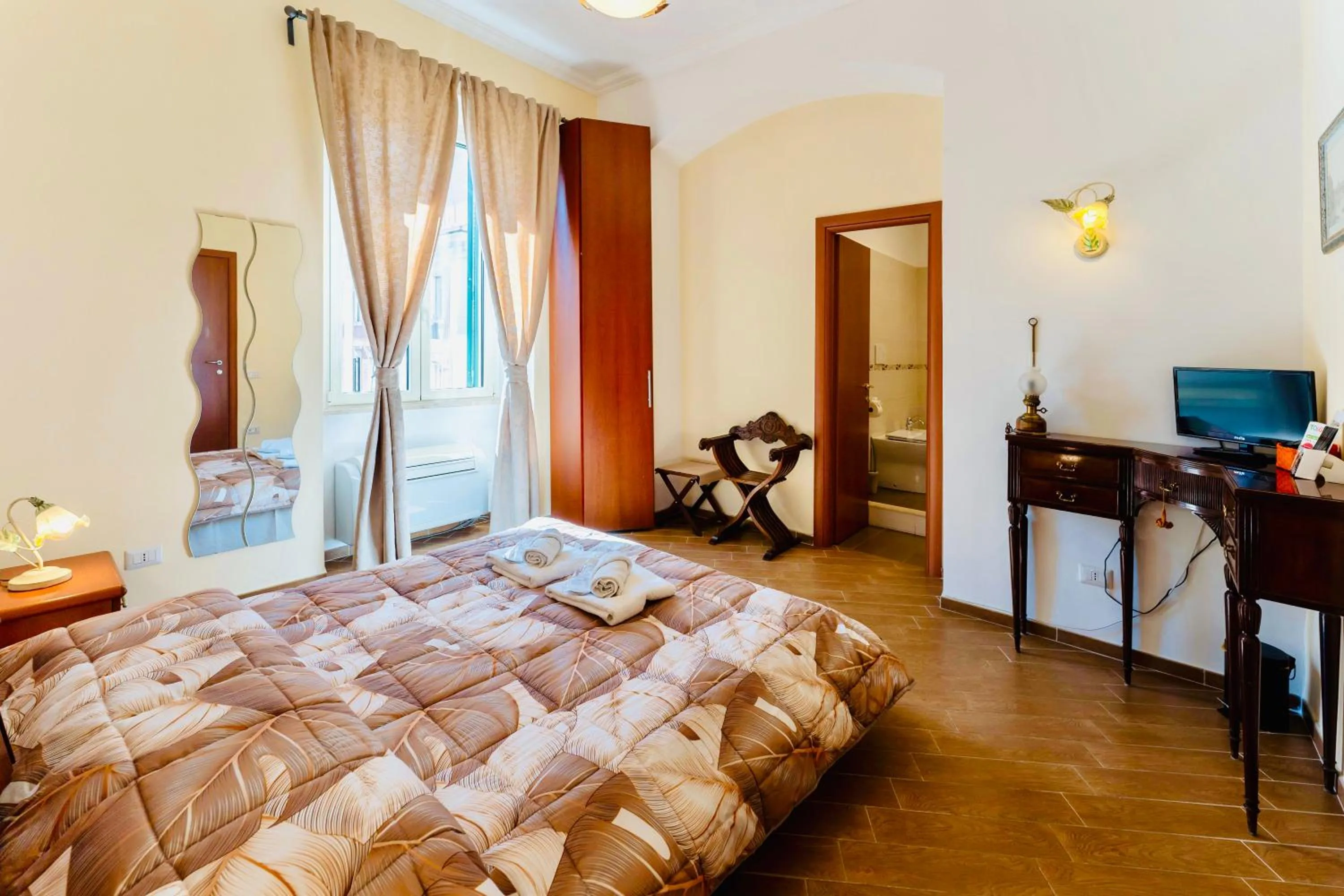 Bed in MICLAD Colosseum Guest House