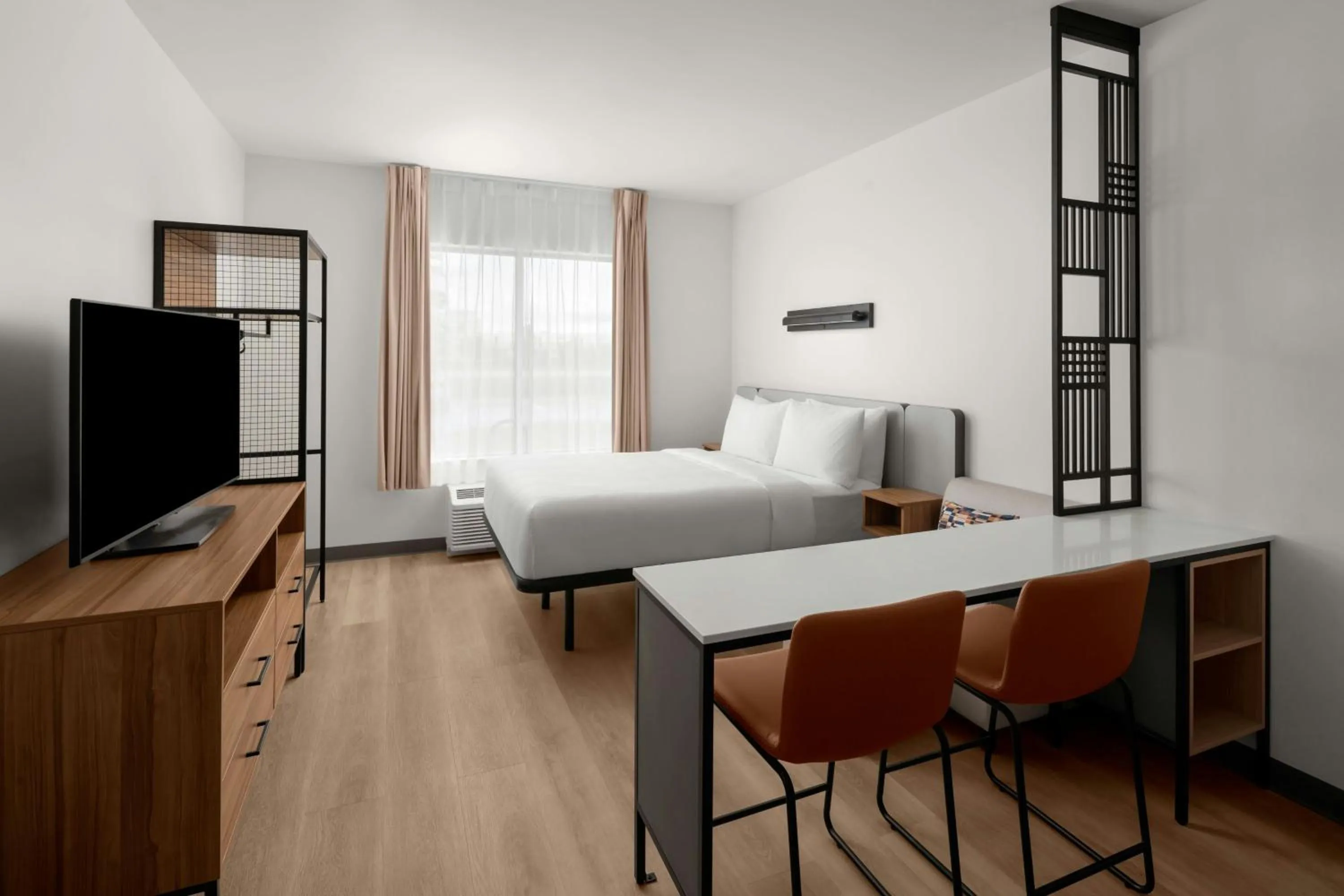 Living room, Bed in StudioRes by Marriott Fort Myers Airport