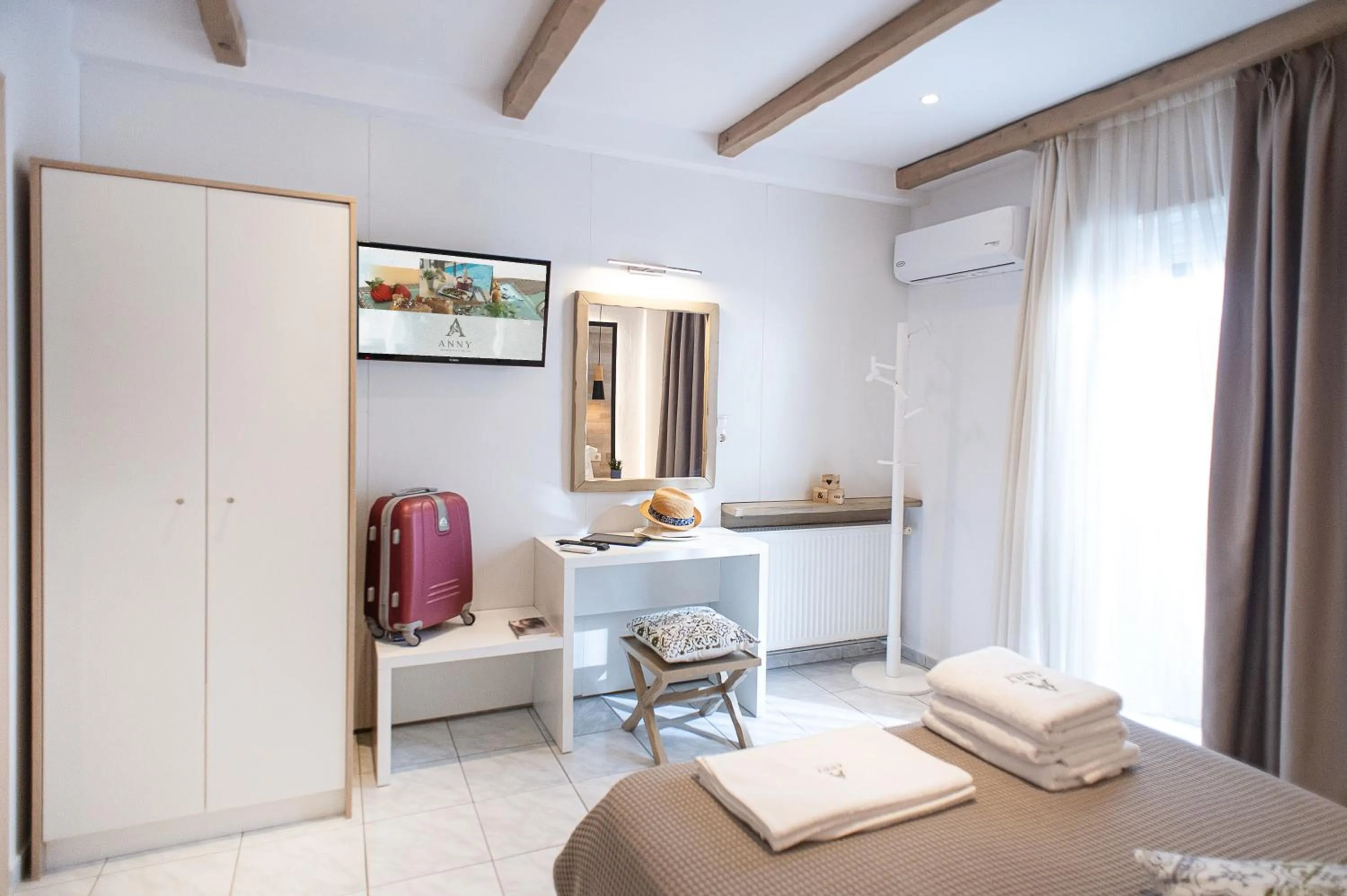 Bed in Anny's Residences & Suites