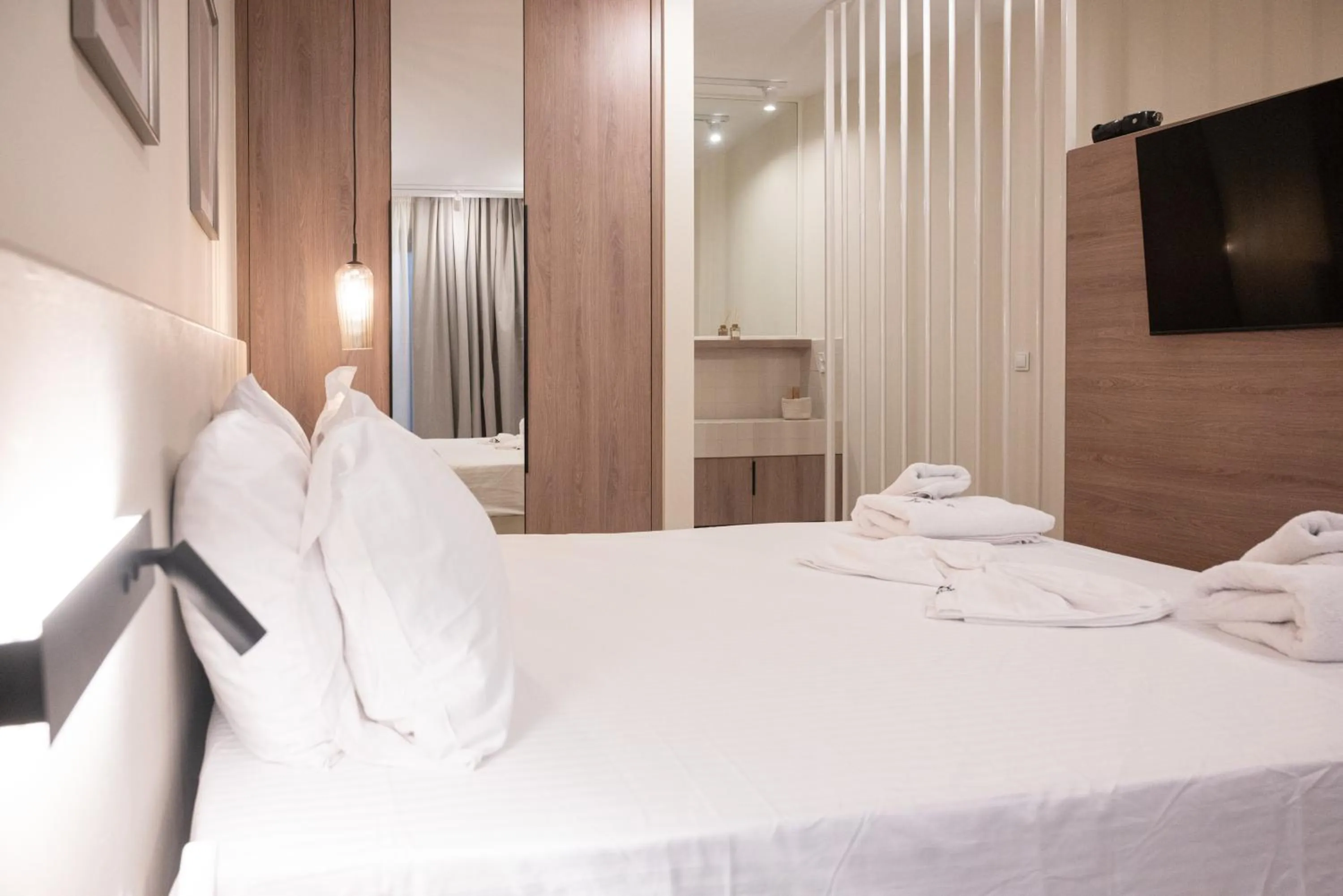 Bed in Anny's Residences & Suites