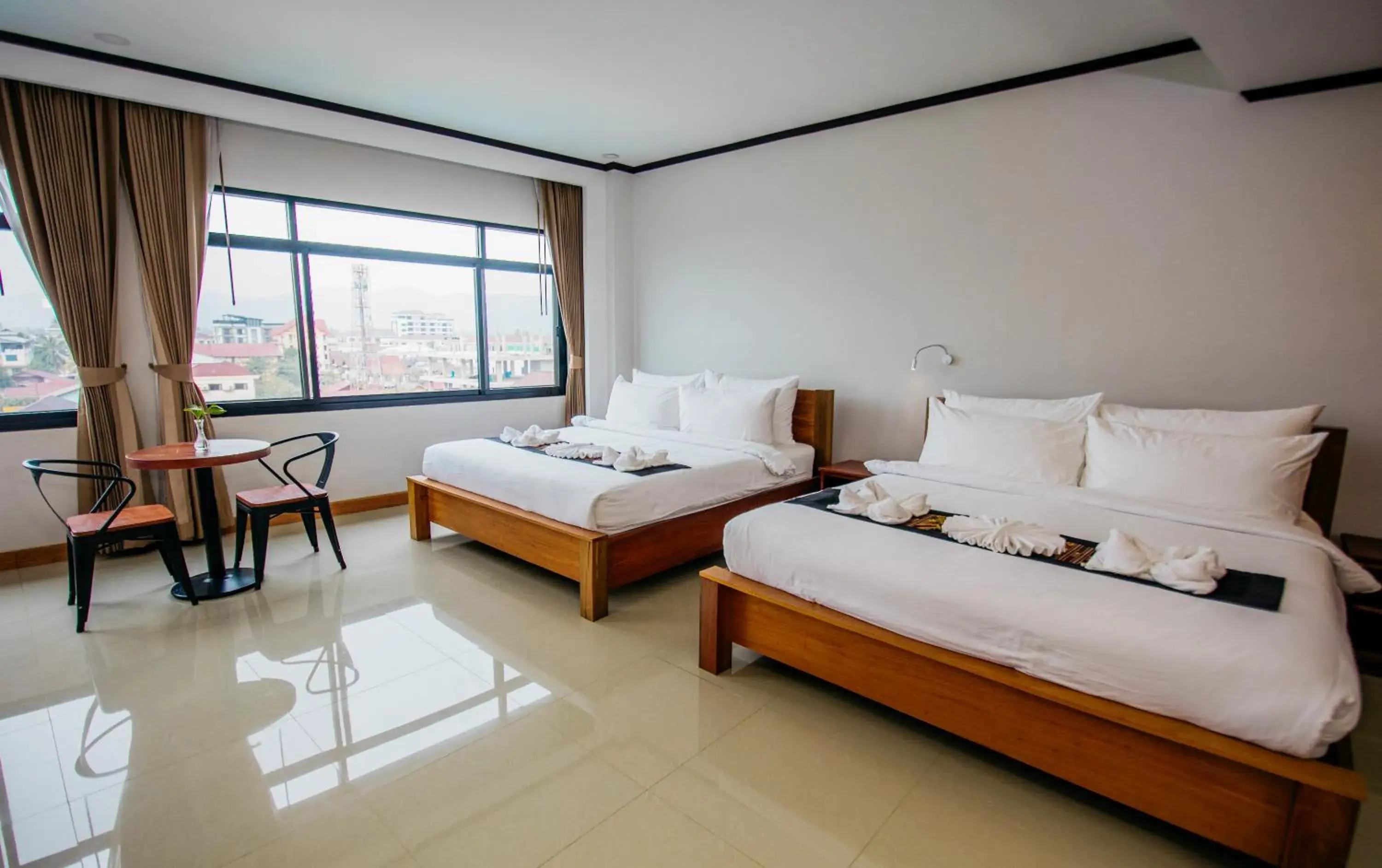 Bed in Sisombat Plaza Hotel Bed in Sisombat Plaza Hotel