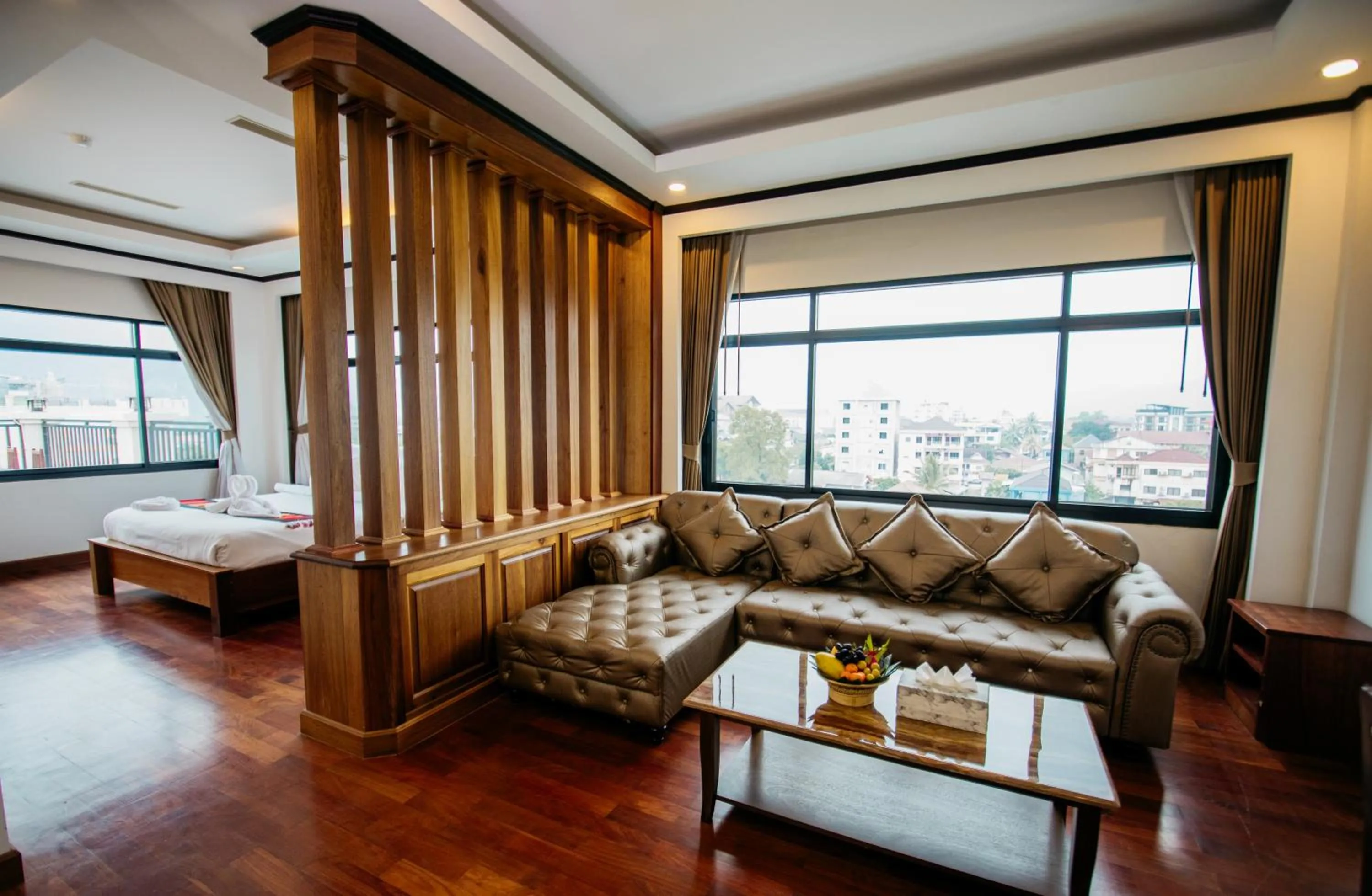 Bed in Sisombat Plaza Hotel