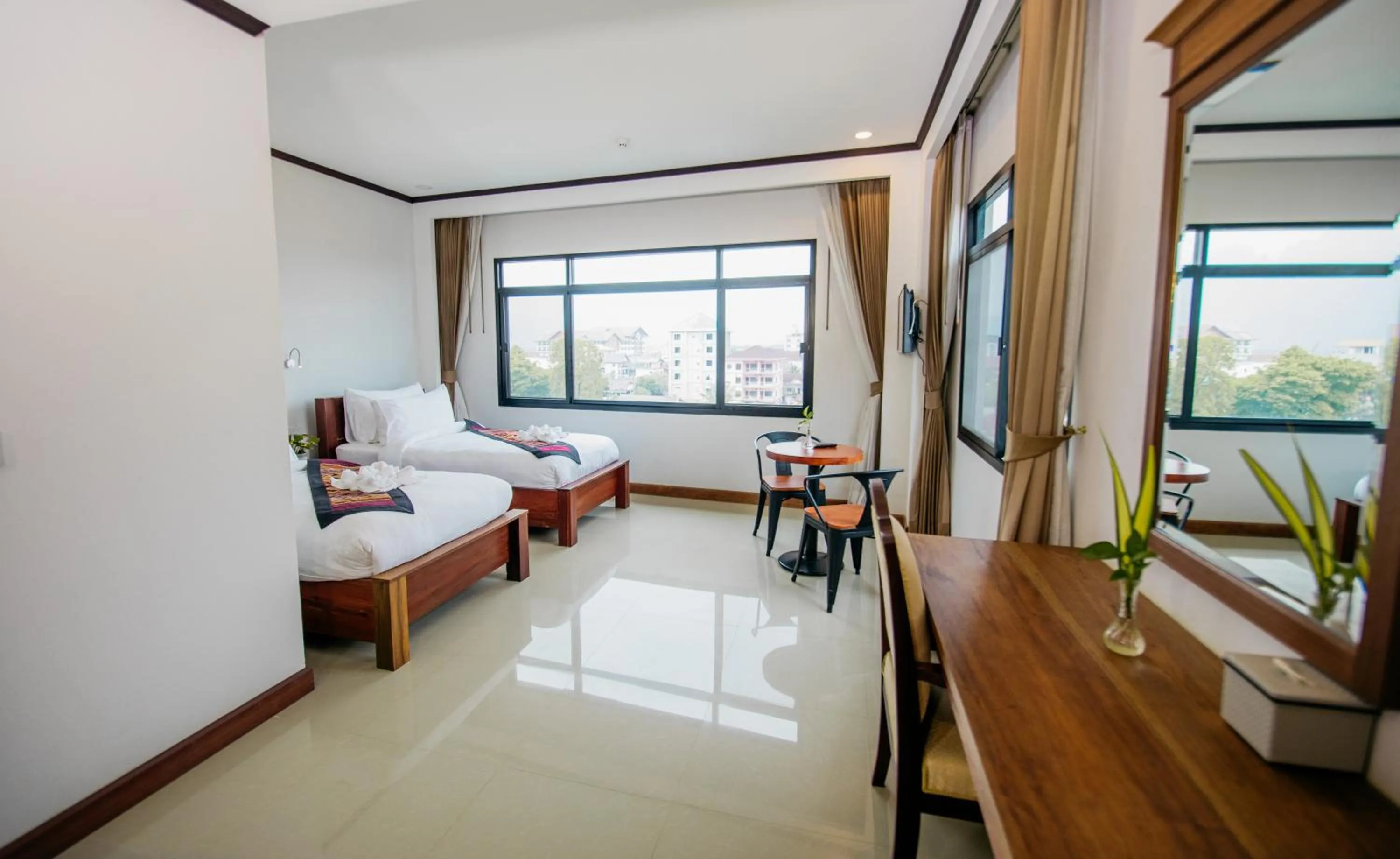 Bed in Sisombat Plaza Hotel