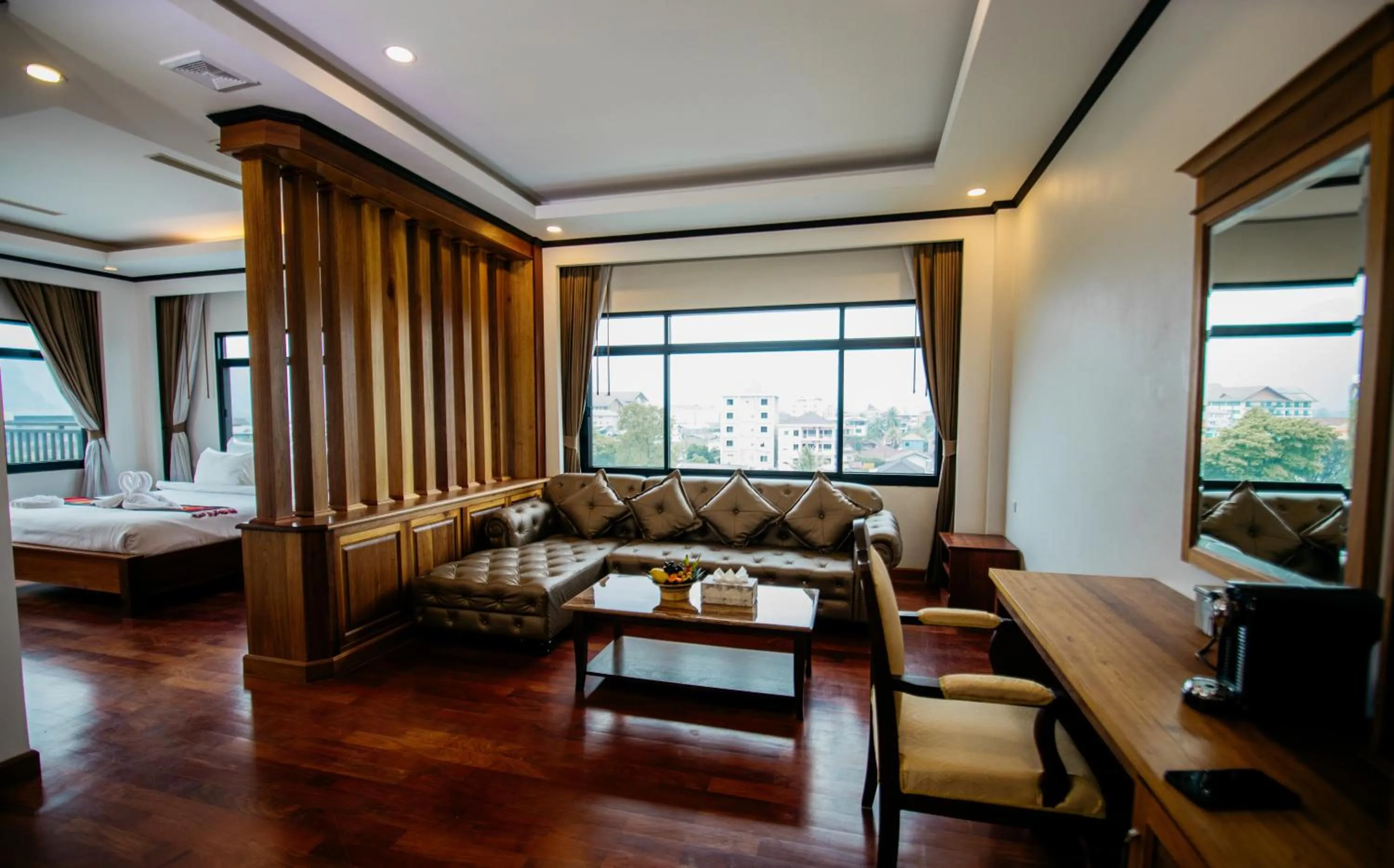 Seating area, Bed in Sisombat Plaza Hotel