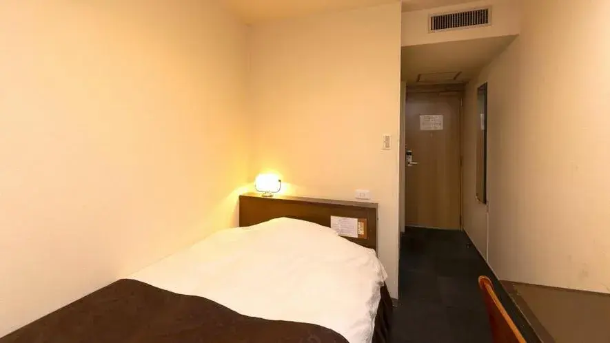 Bed in New Gloria Oita Hotel Bed in New Gloria Oita Hotel