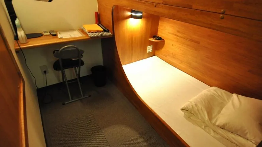 Bed in New Gloria Oita Hotel