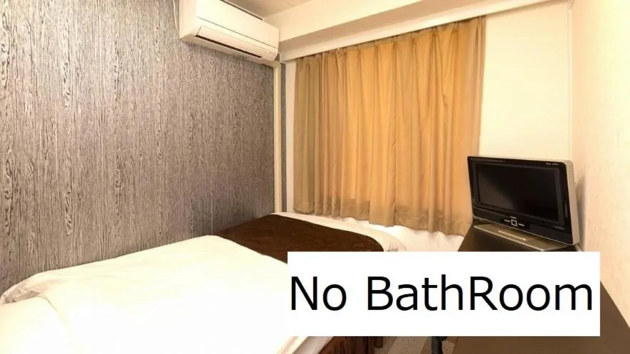 Bed in New Gloria Oita Hotel