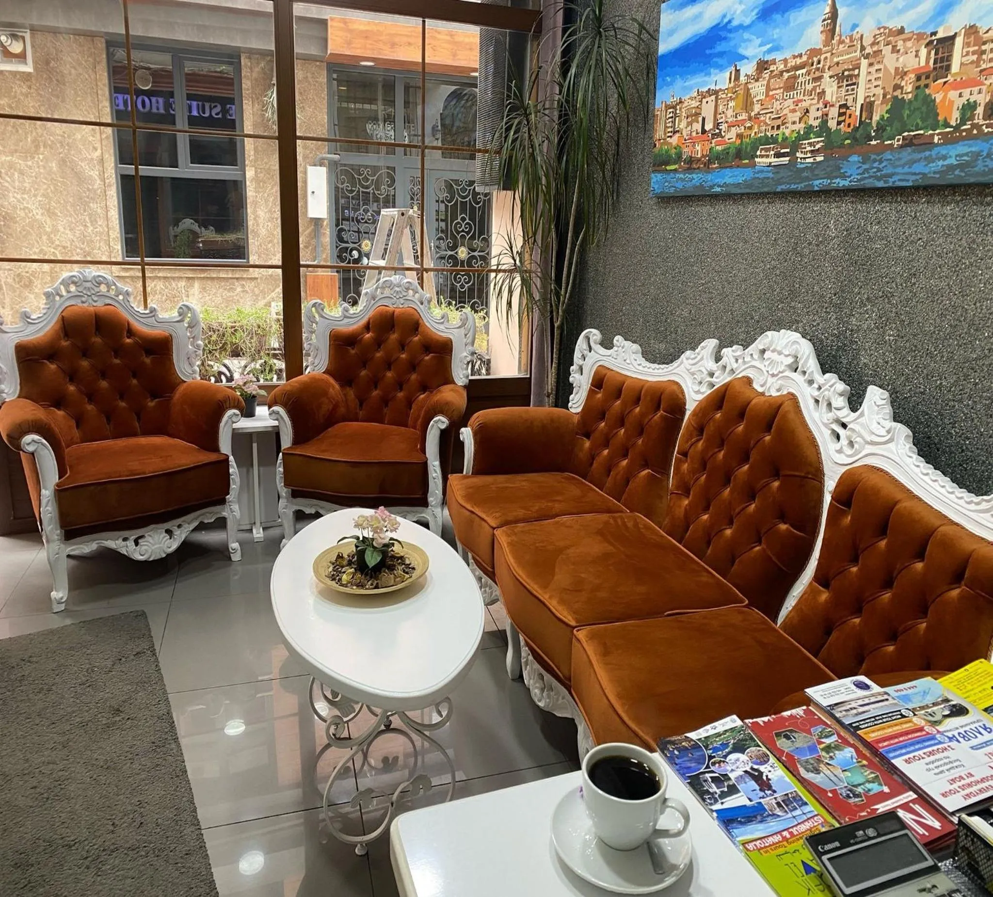 Lobby or reception in Unique Suite Hotel