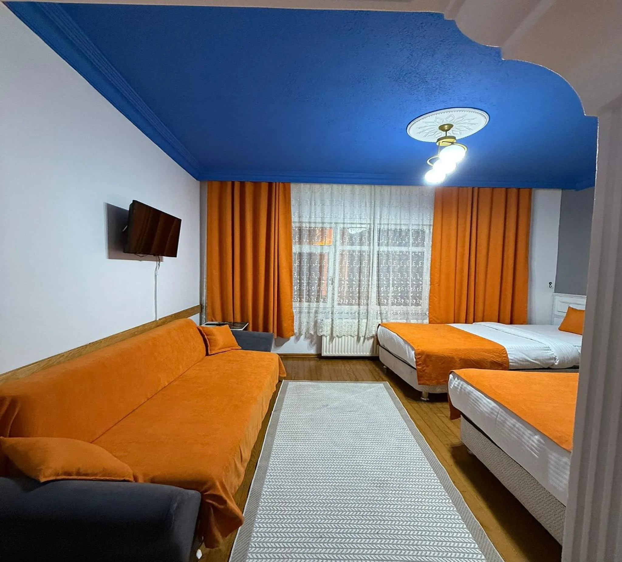 Seating area, Bed in Unique Suite Hotel