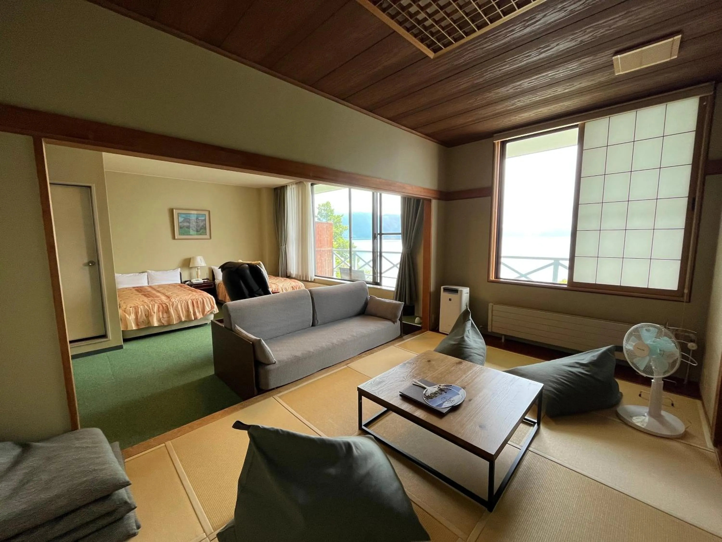 Living room, Bed in Sapporo's Secret Onsen Sanctuary Marukoma Onsen Ryokan