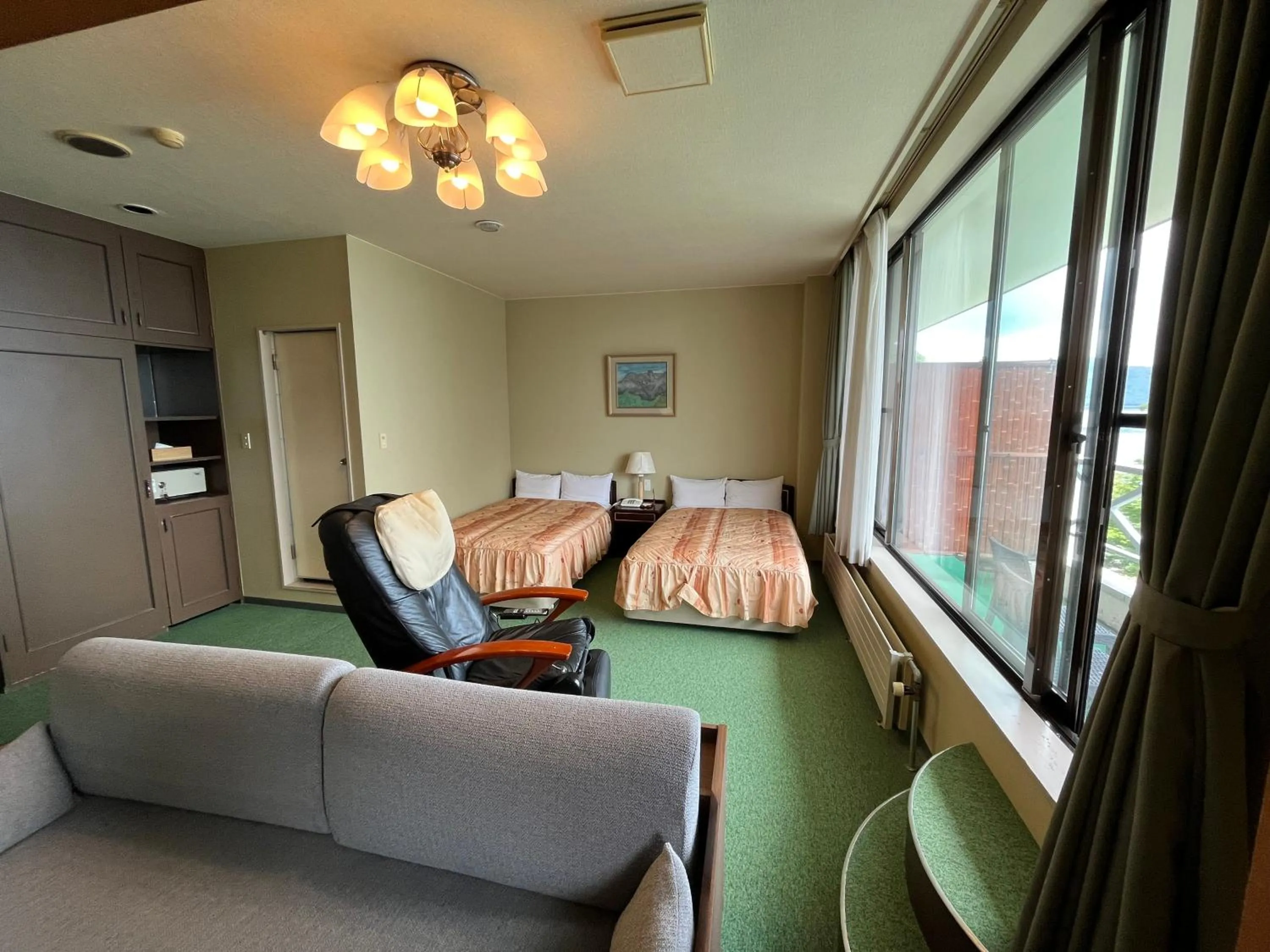 Living room, Bed in Sapporo's Secret Onsen Sanctuary Marukoma Onsen Ryokan