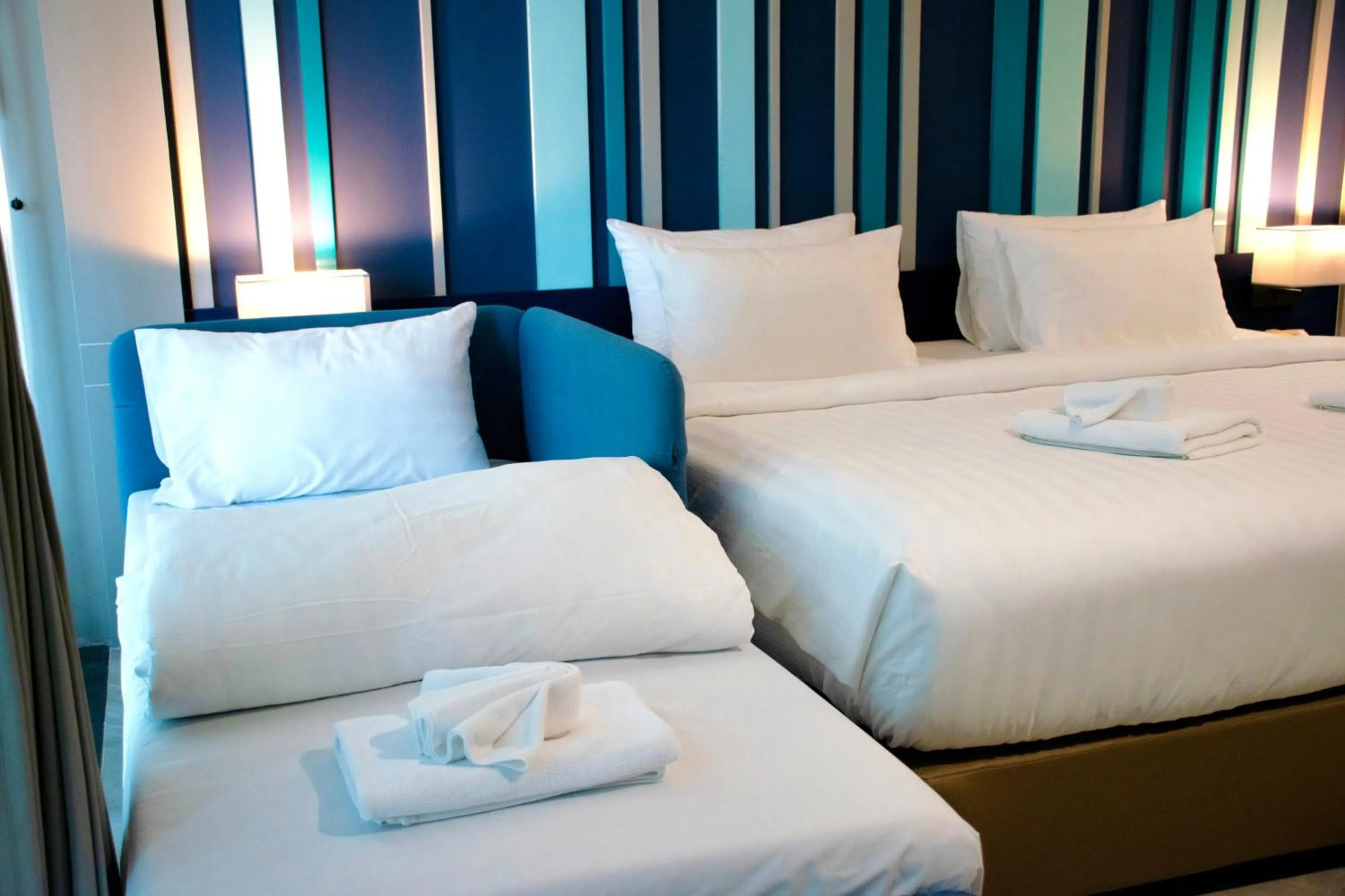 Bed in @T Boutique Hotel