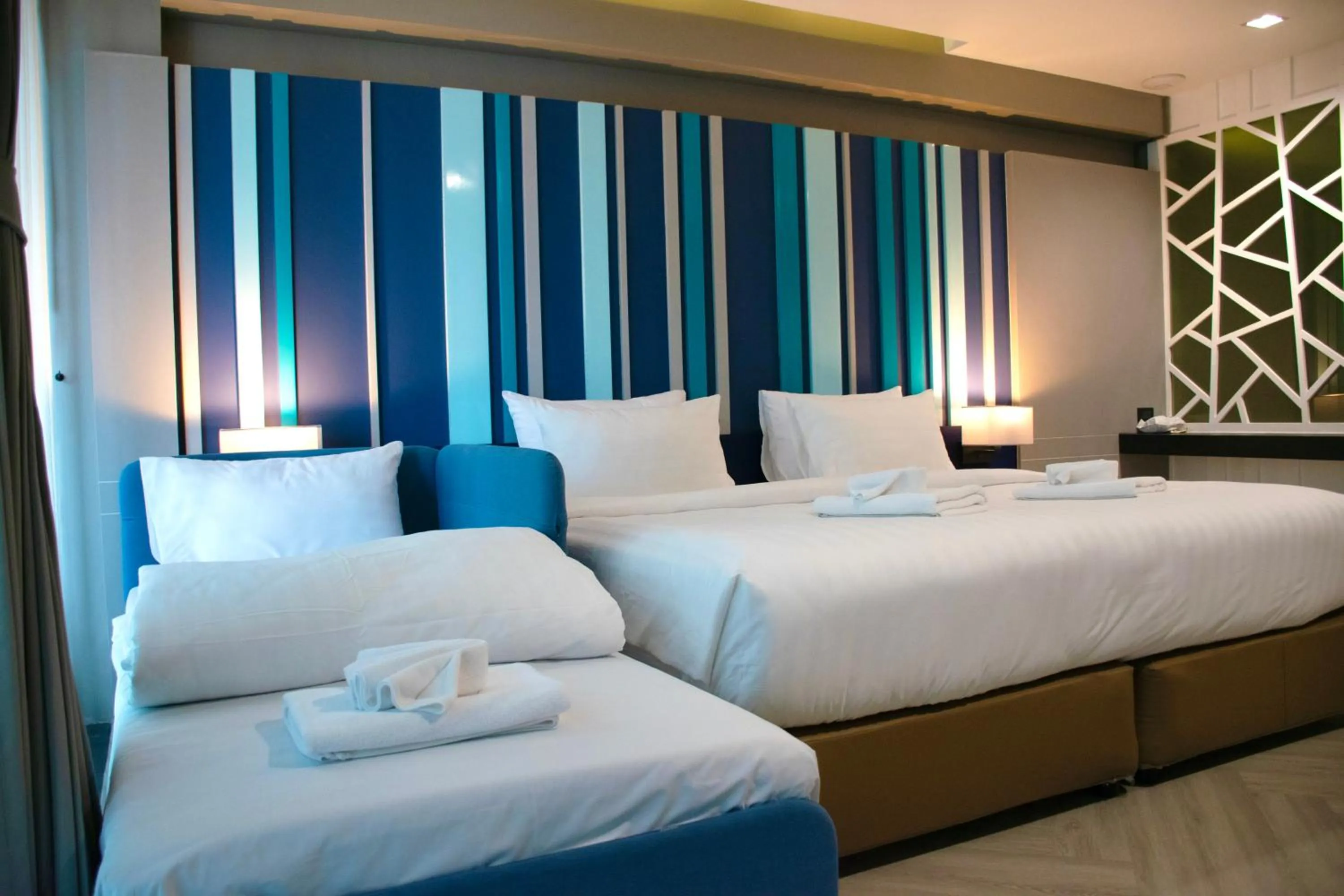 Bed in @T Boutique Hotel