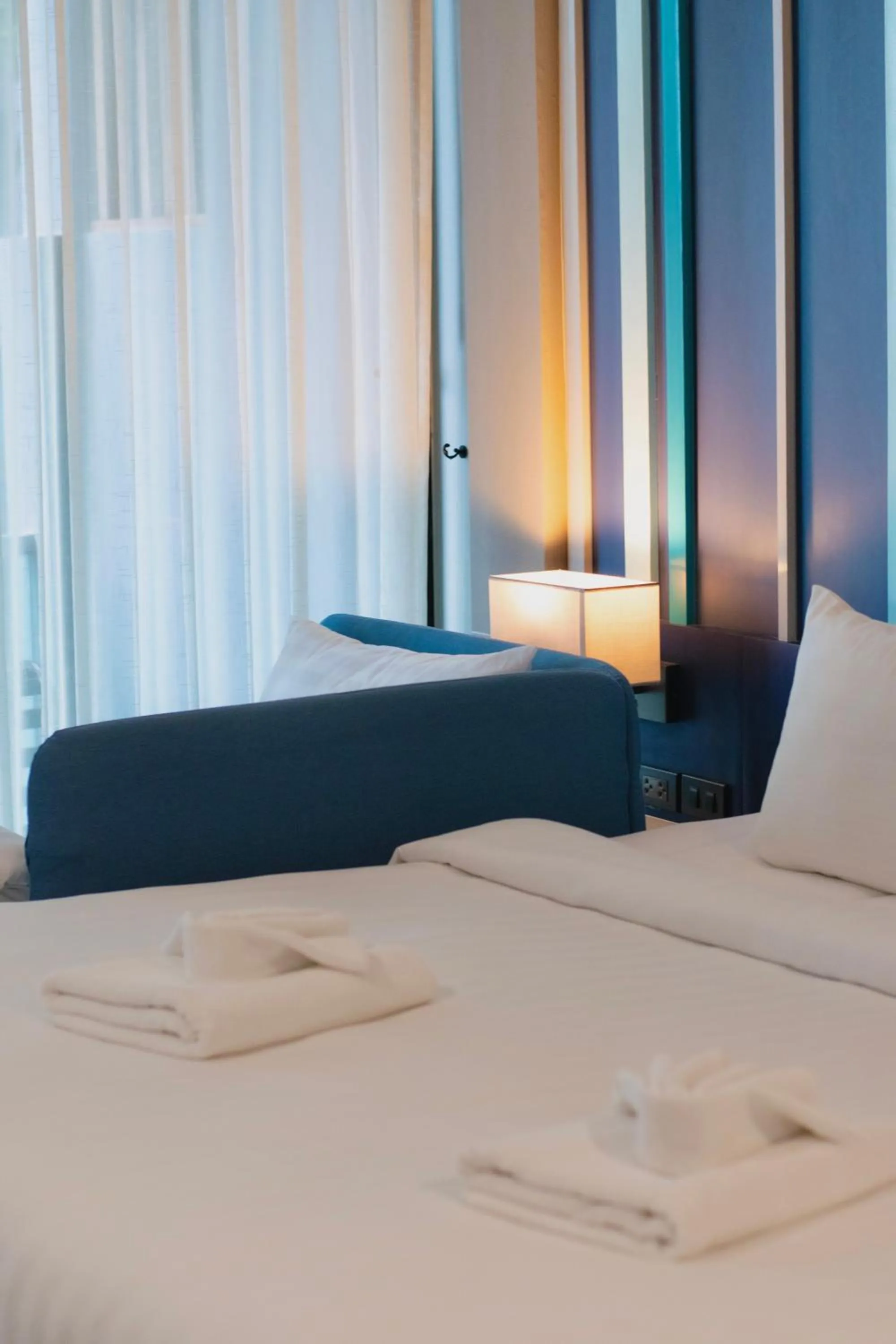 Bed in @T Boutique Hotel