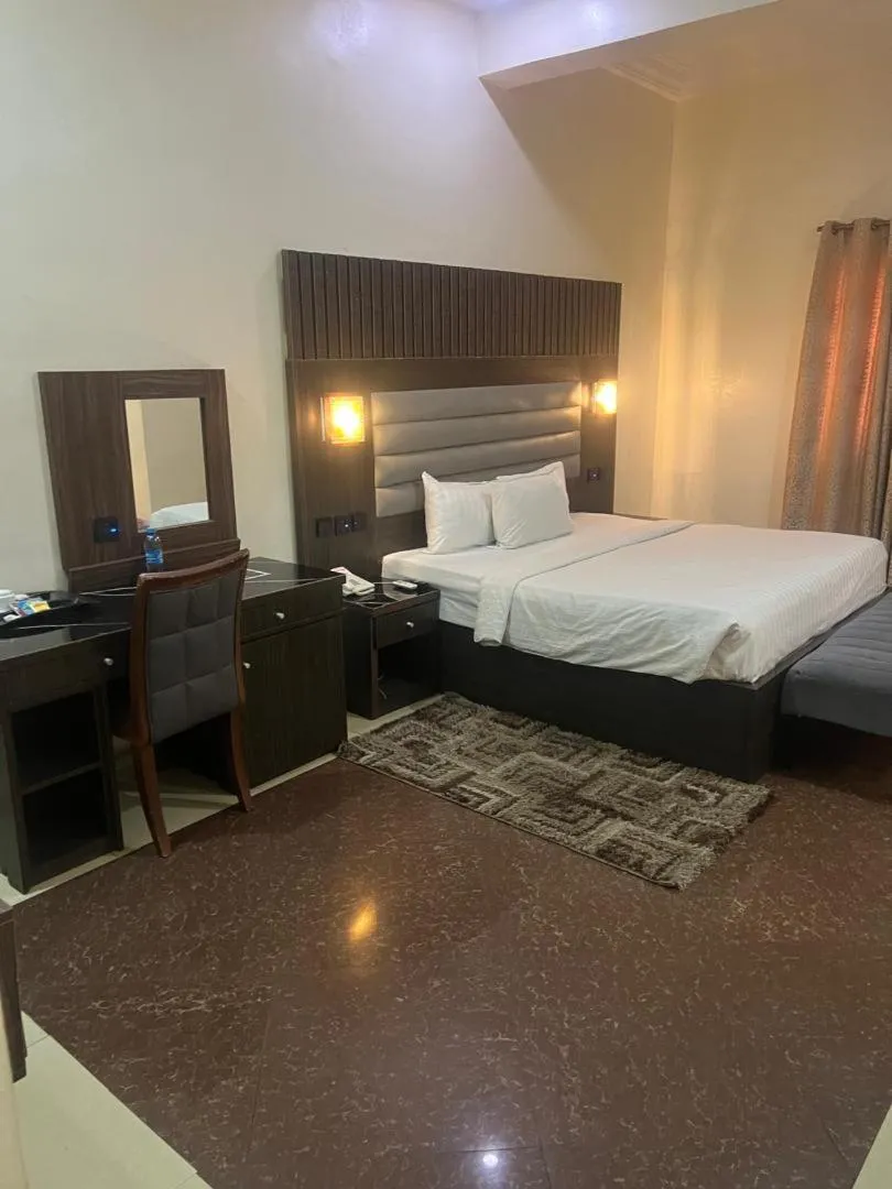 Bed in Nippon Grand Hotel and Apartment