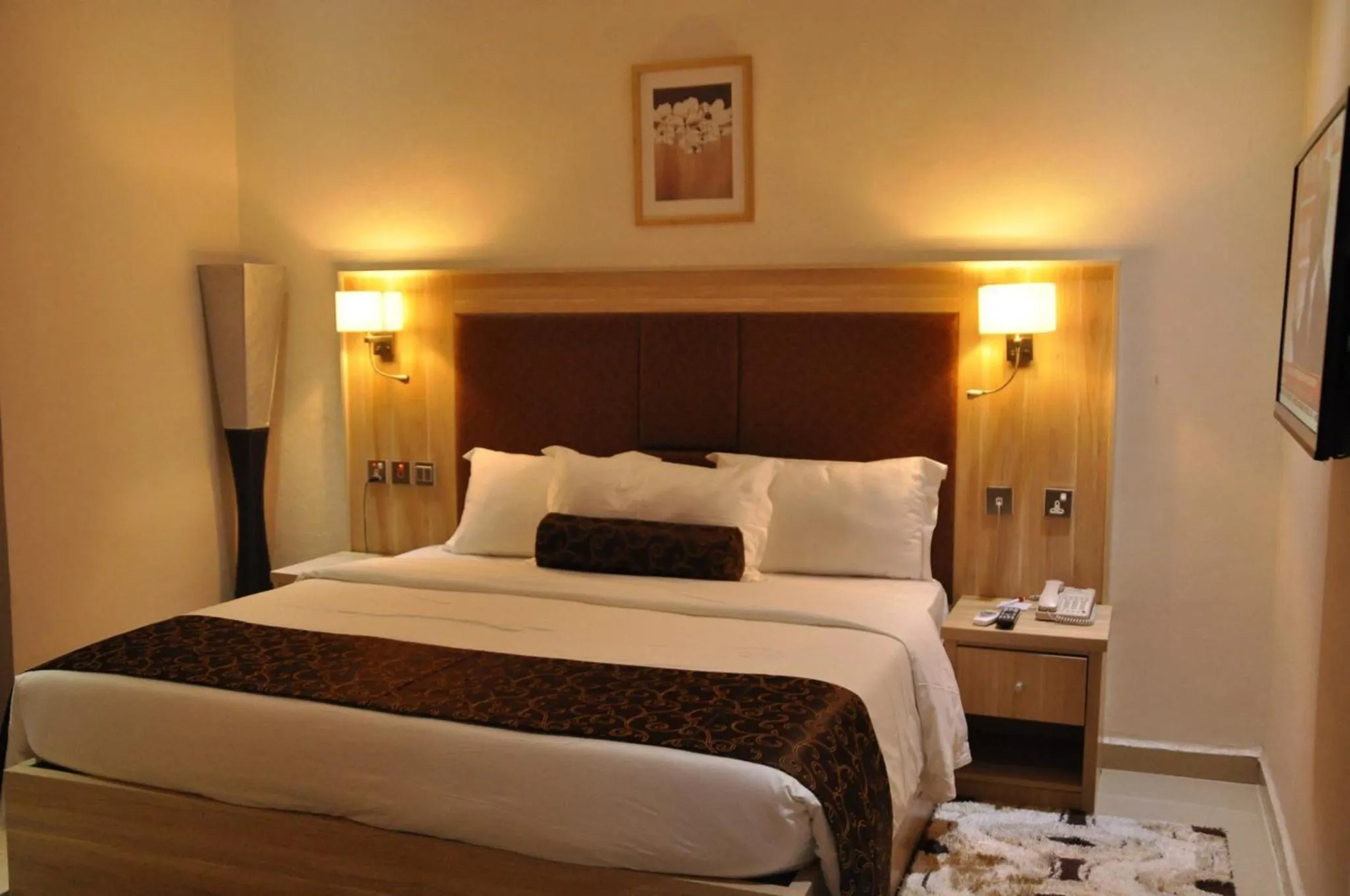 Bed in Nippon Grand Hotel and Apartment