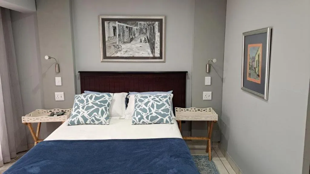 Bed in Dormio Manor Guest Lodge