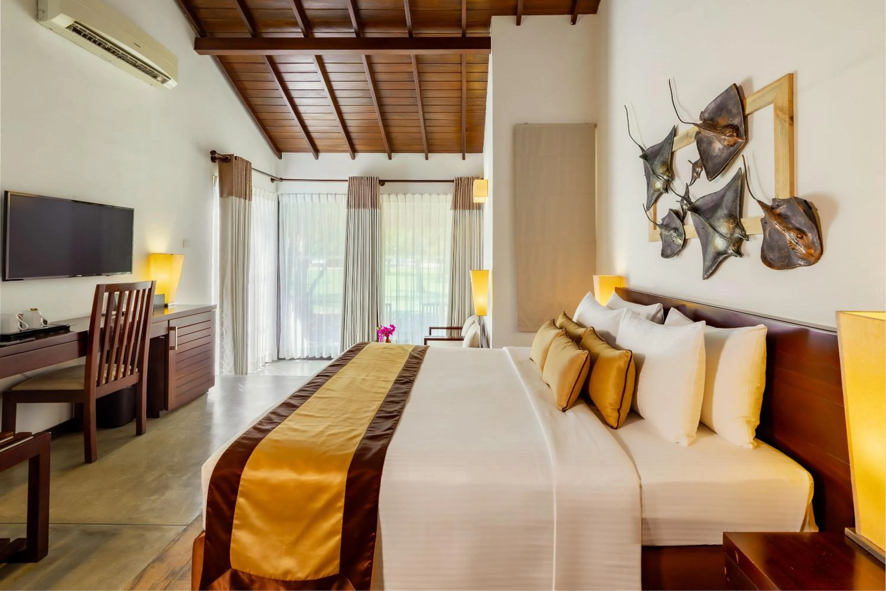 Bed in The Calm Resort & Spa