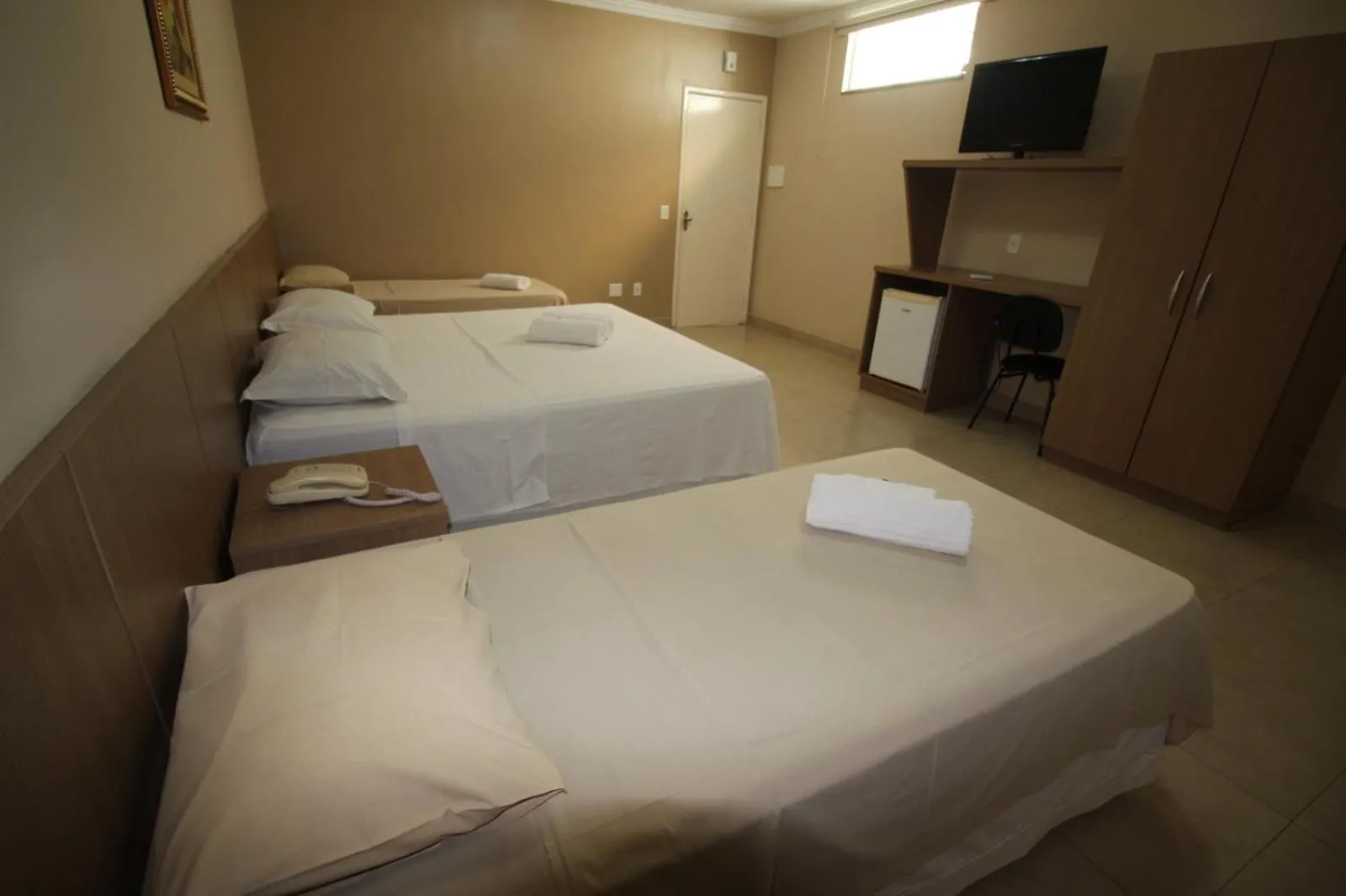 TV and multimedia, Bed in Hotel Regina Muriaé